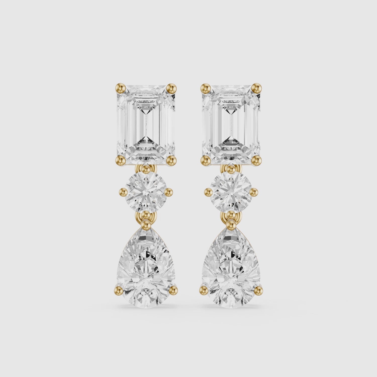 Load video: Gracelyn Emerald, Round and Pear Cut Lab Grown Diamond Dangle Earrings