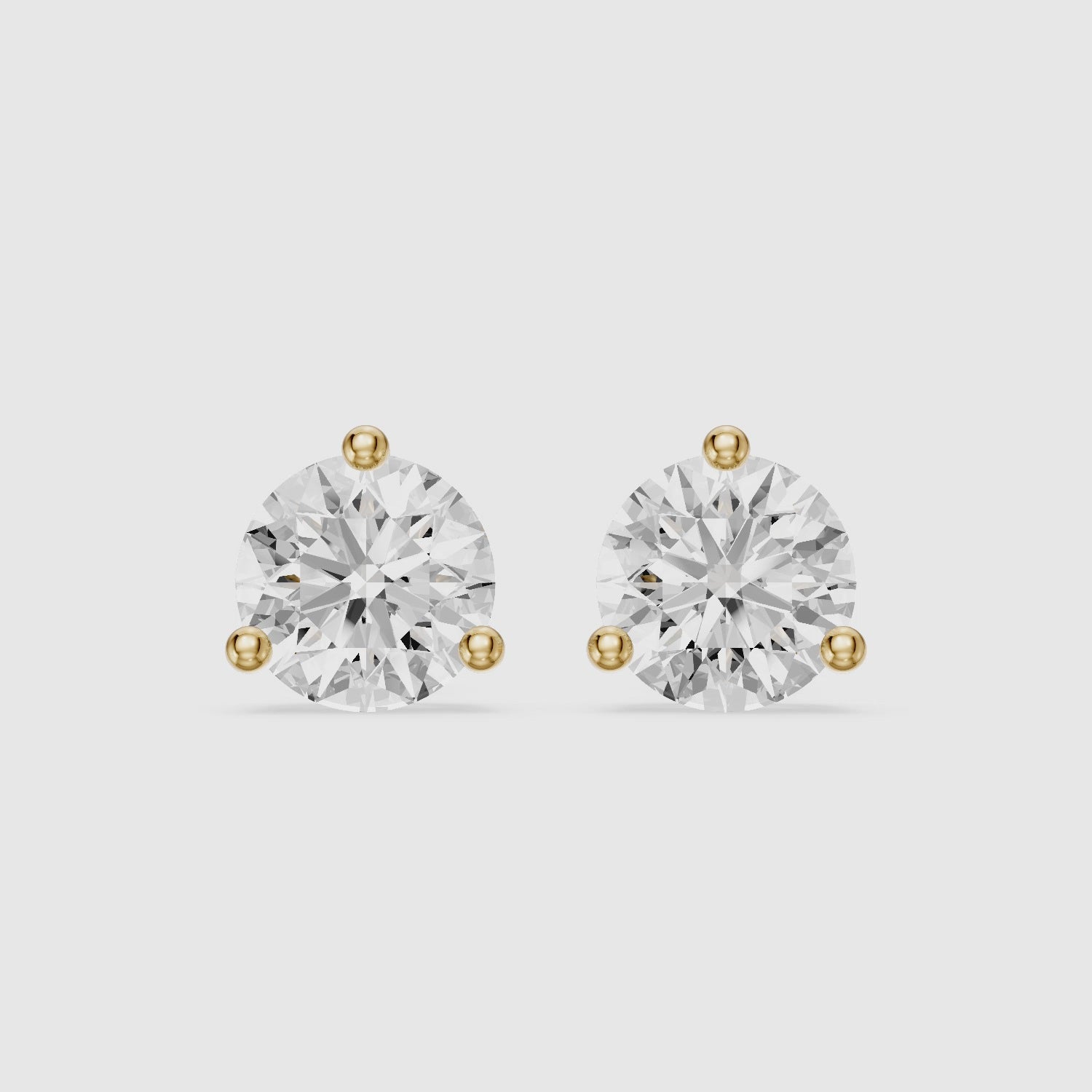 Load video: Daria Round Cut Lab Diamond Three Prong Solitaire Stud Earrings