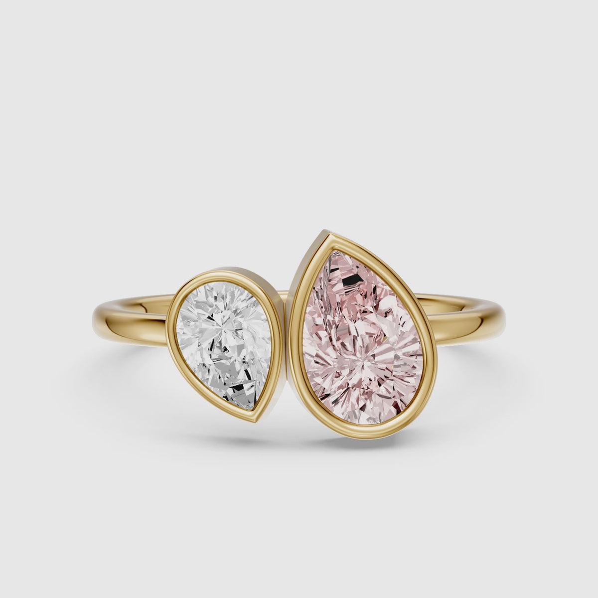 Load video: Prisca Pink and White Pear Cut Colored Lab Grown Diamond Toi et Moi Bezel Ring