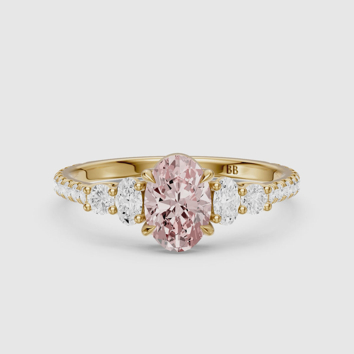 Load video: Eska Oval Cut Pink Lab Grown Diamond Ring with Oval and Round Side Diamonds