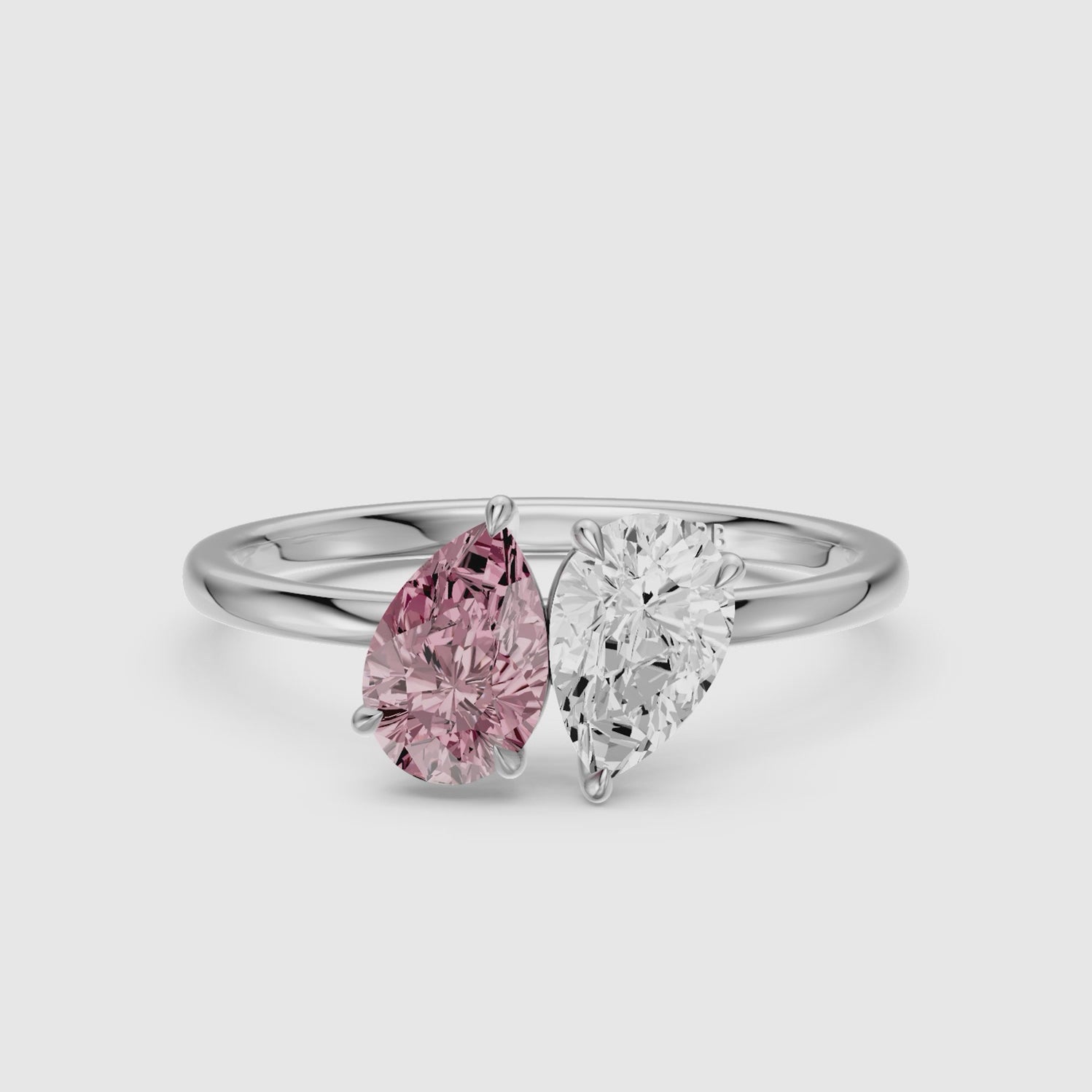 Load video: Audra Pink and White Both Pear Cut Color Lab Grown Diamond Toi et Moi Ring