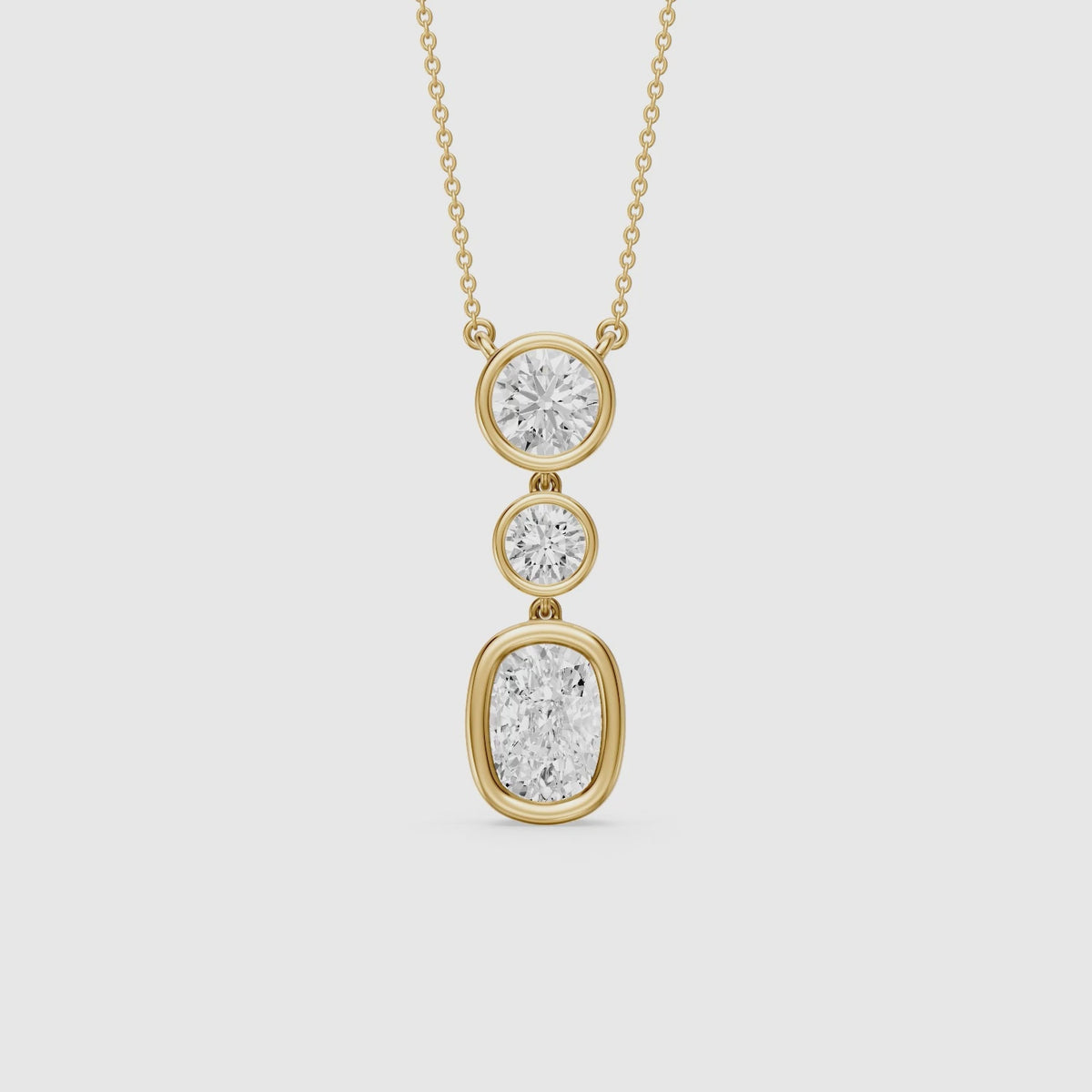 Load video: Demi Elongated Cushion and Round Bezel Lab Grown Diamond Drop Pendant