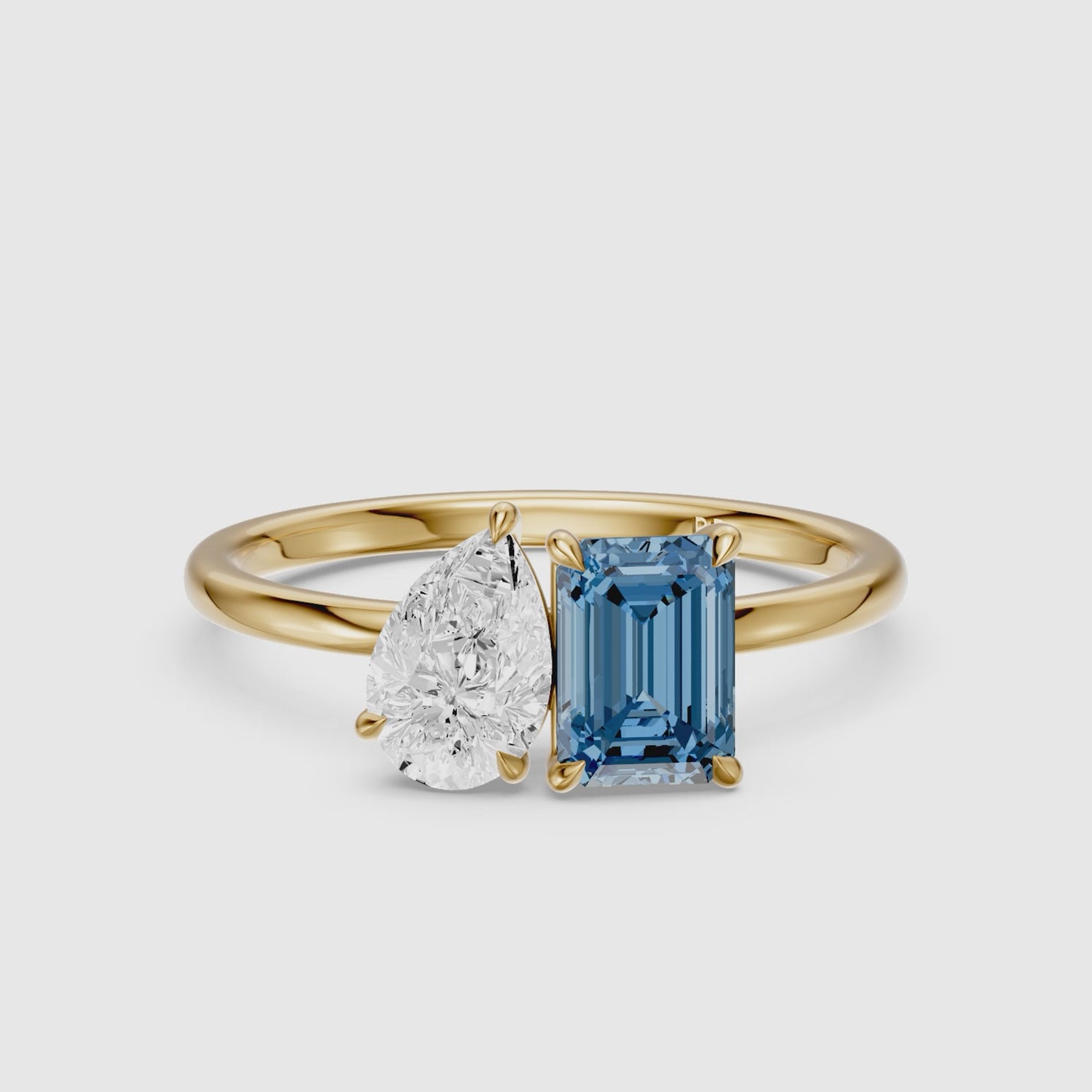 Load video: Runa Blue Emerald Cut and Pear Shape Color Lab Grown Diamond Toi et Moi Ring