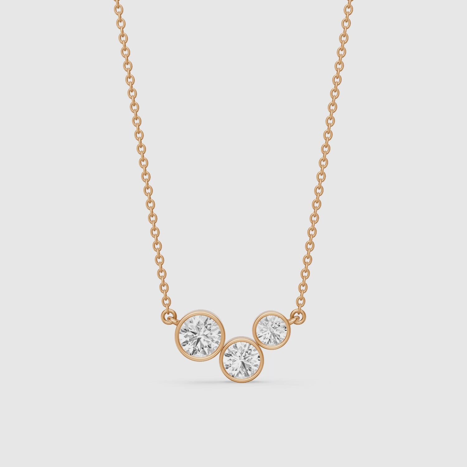 Load video: Hoorain Three Stone Round Lab Grown Diamond Bezel Pendant