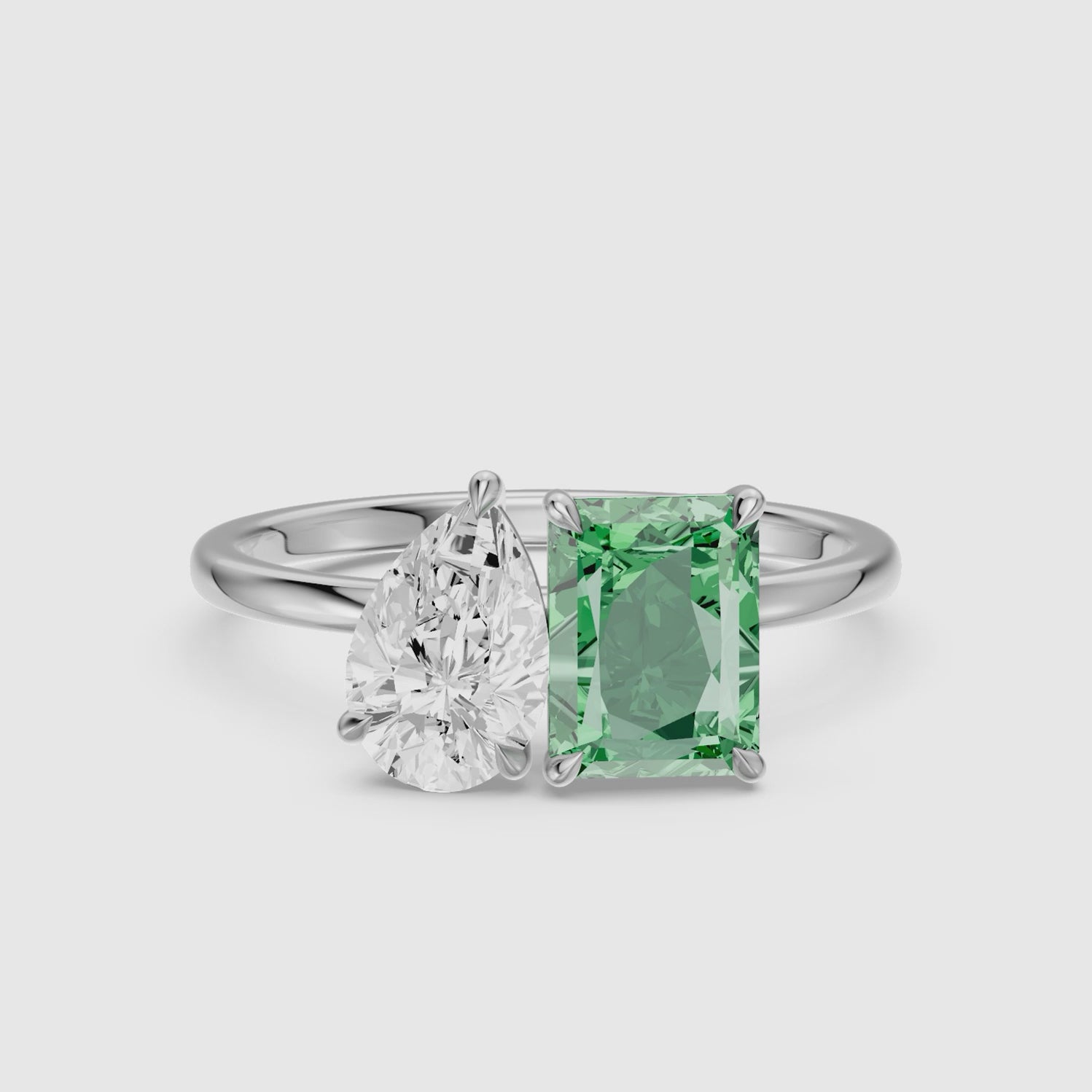 Load video: Cybele Green Radiant and Pear Cut Colored Lab Grown Diamond Toi et Moi Ring