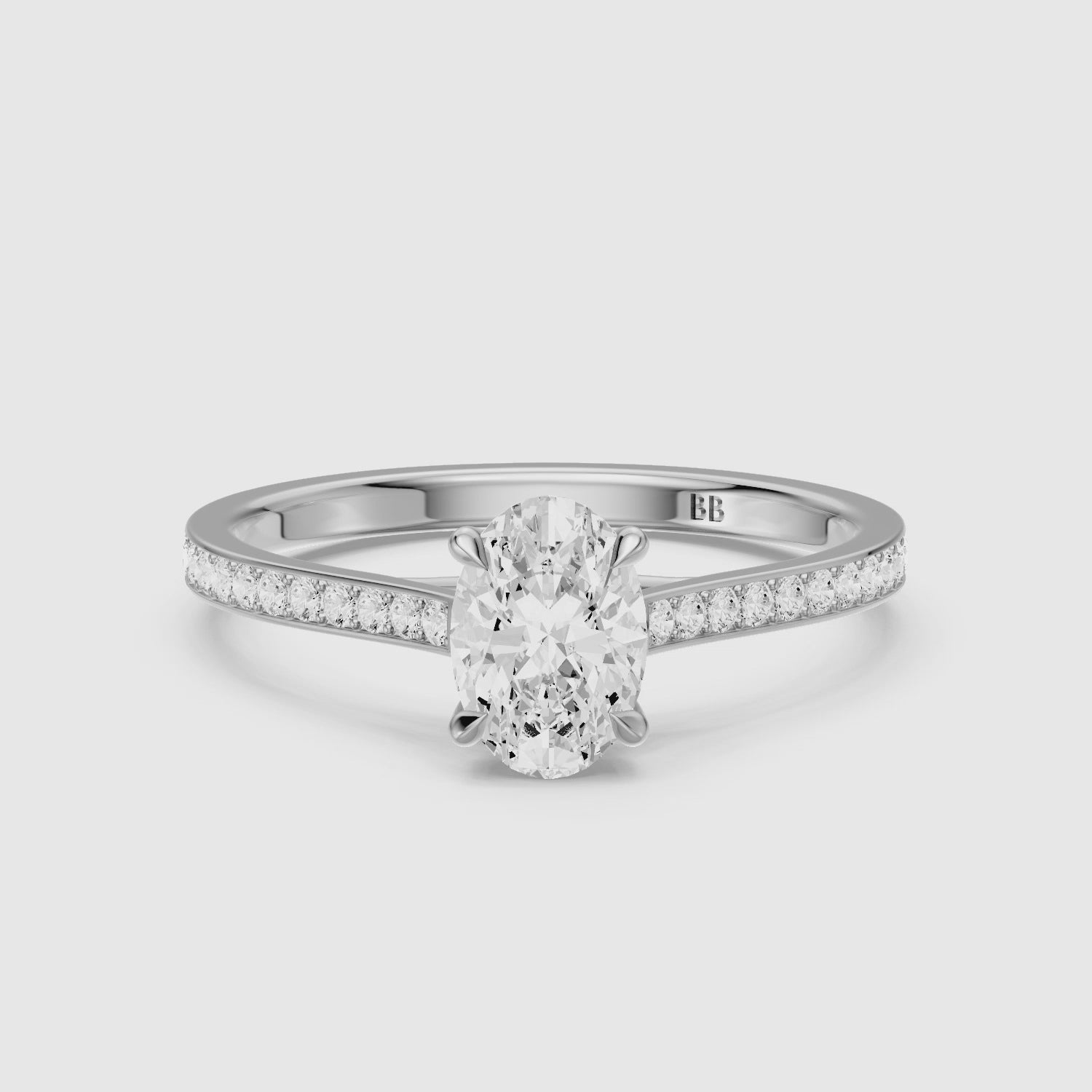 Load video: Kairen 4 Prong Oval Cut Side Stone Channel Set Moissanite Diamond Ring