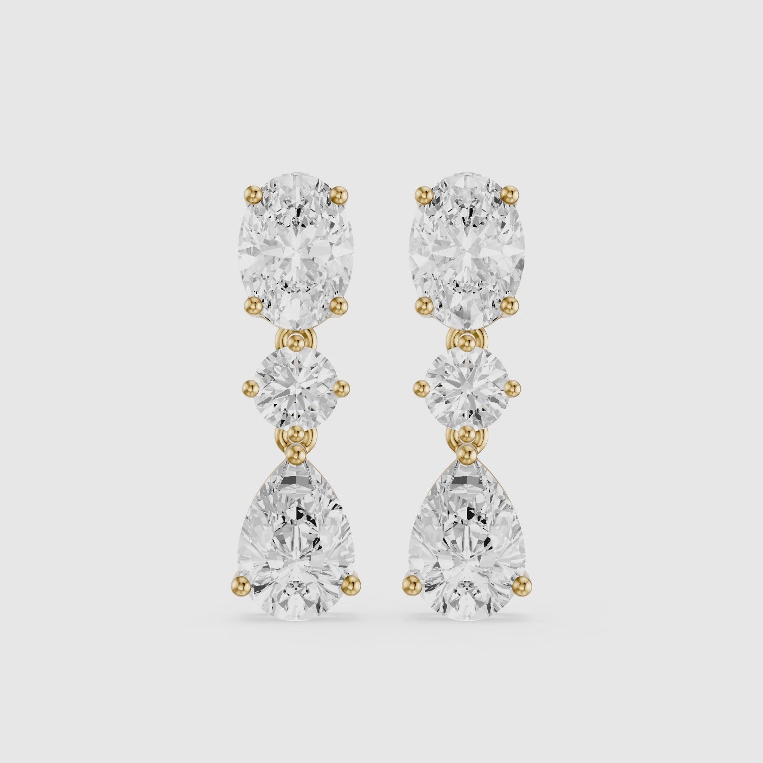 Load video: Iliana Oval, Round and Pear Cut Lab Grown Diamond Dangle Earrings