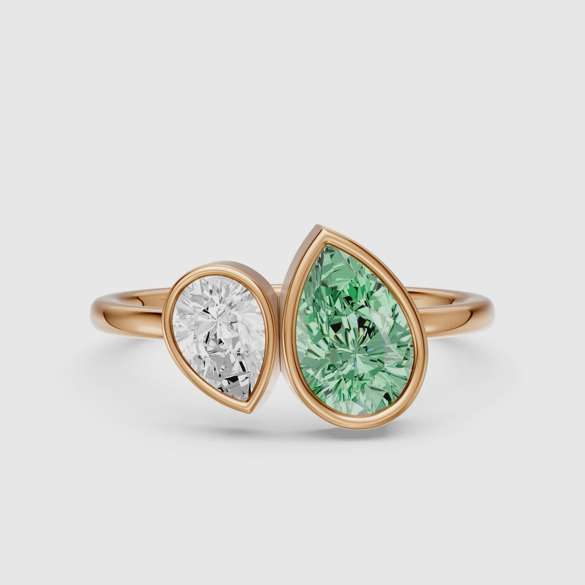 Load video: Oriana Green and White Pear Cut Colored Lab Grown Diamond Toi et Moi Bezel Ring