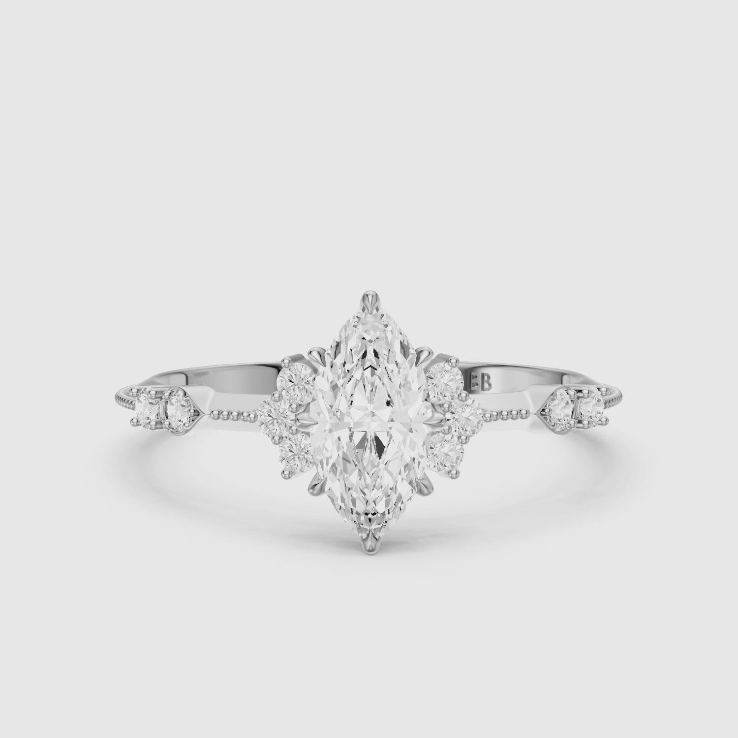 Load video: Wren Marquise Moissanite Diamond Ring with Cluster Side Stones and Vintage Band