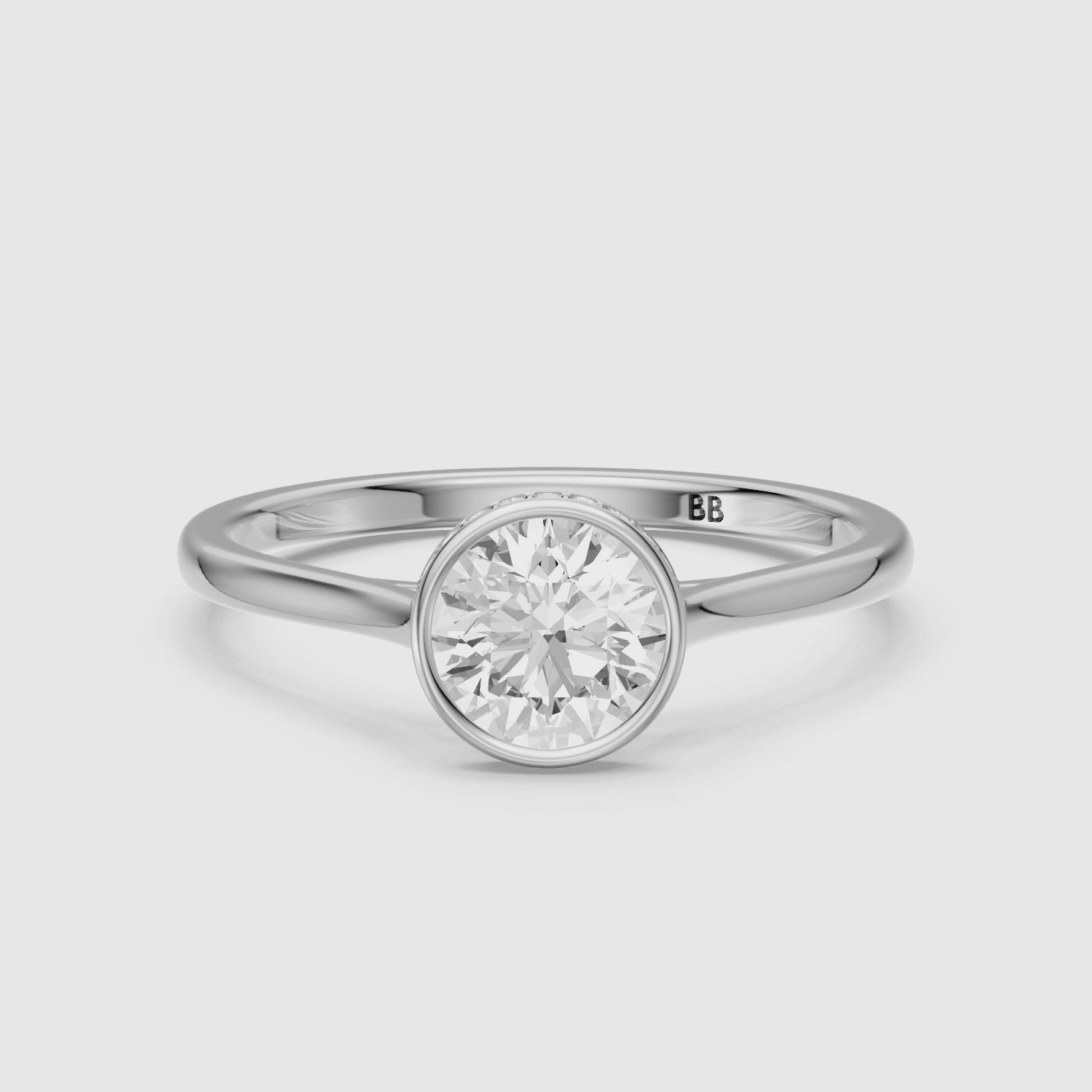 Load video: Kamryn Round Cut Bezel Set Hidden Halo Lab Grown Diamond Ring