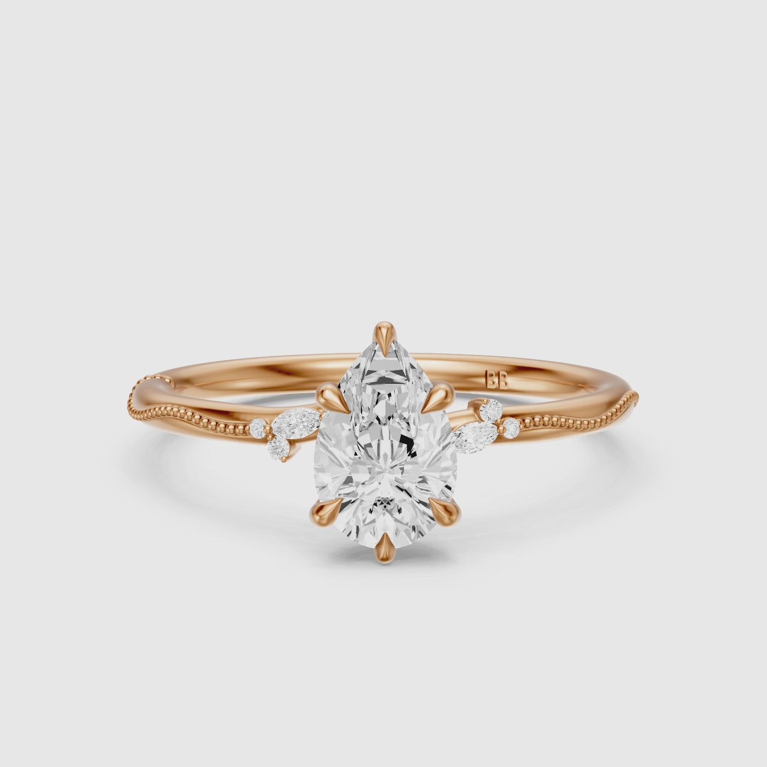 Load video: Cecilia Pear Cut Side Stone Lab Grown Diamond Ring with Milgrain Band