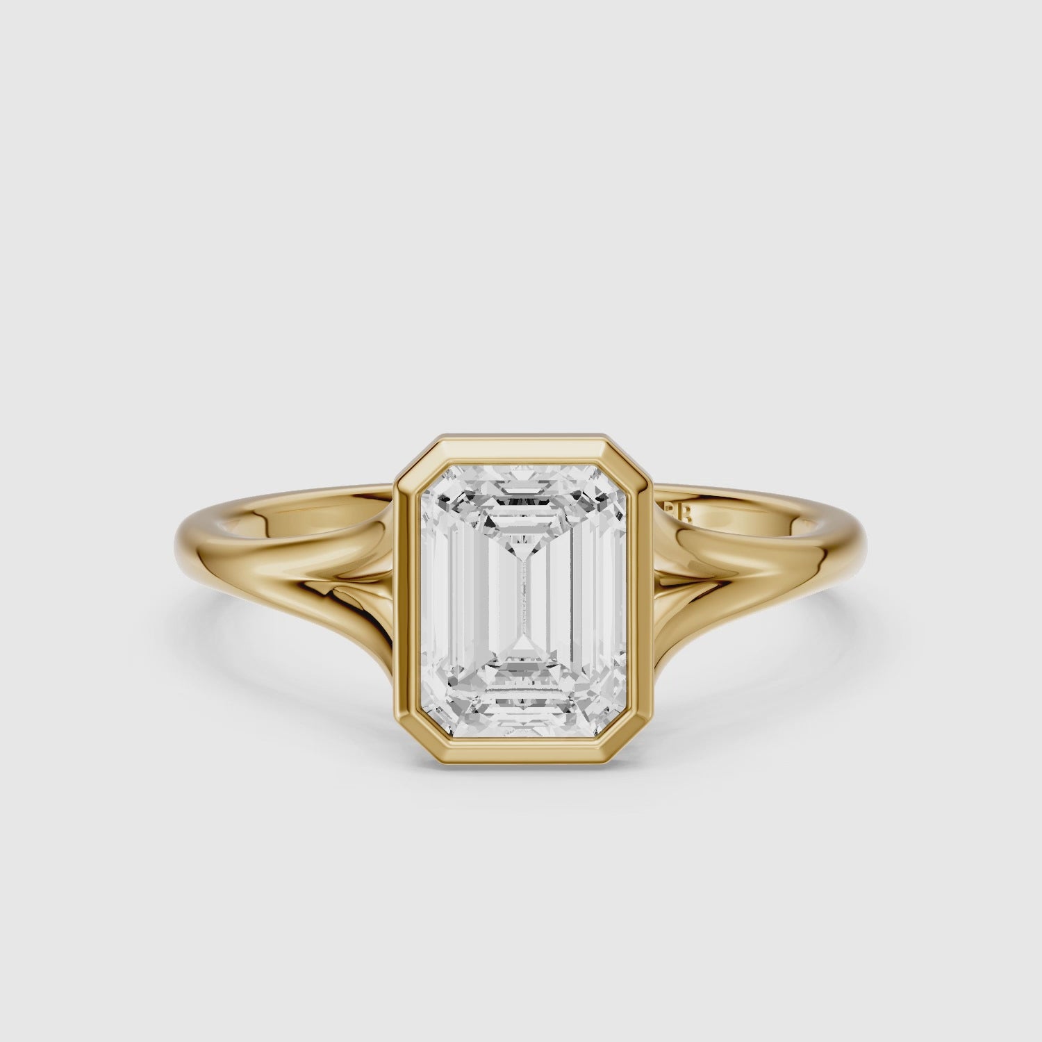 Load video: Milani Emerald Cut Lab Grown Diamond Bezel Solitaire Ring with Split Band
