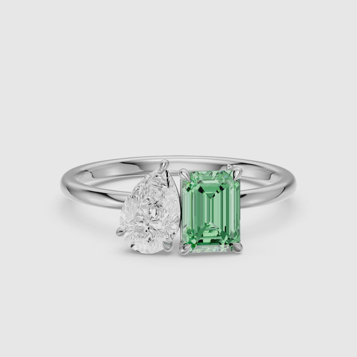Load video: Belle Green Emerald Cut and Pear Shape Color Lab Grown Diamond Toi et Moi Ring