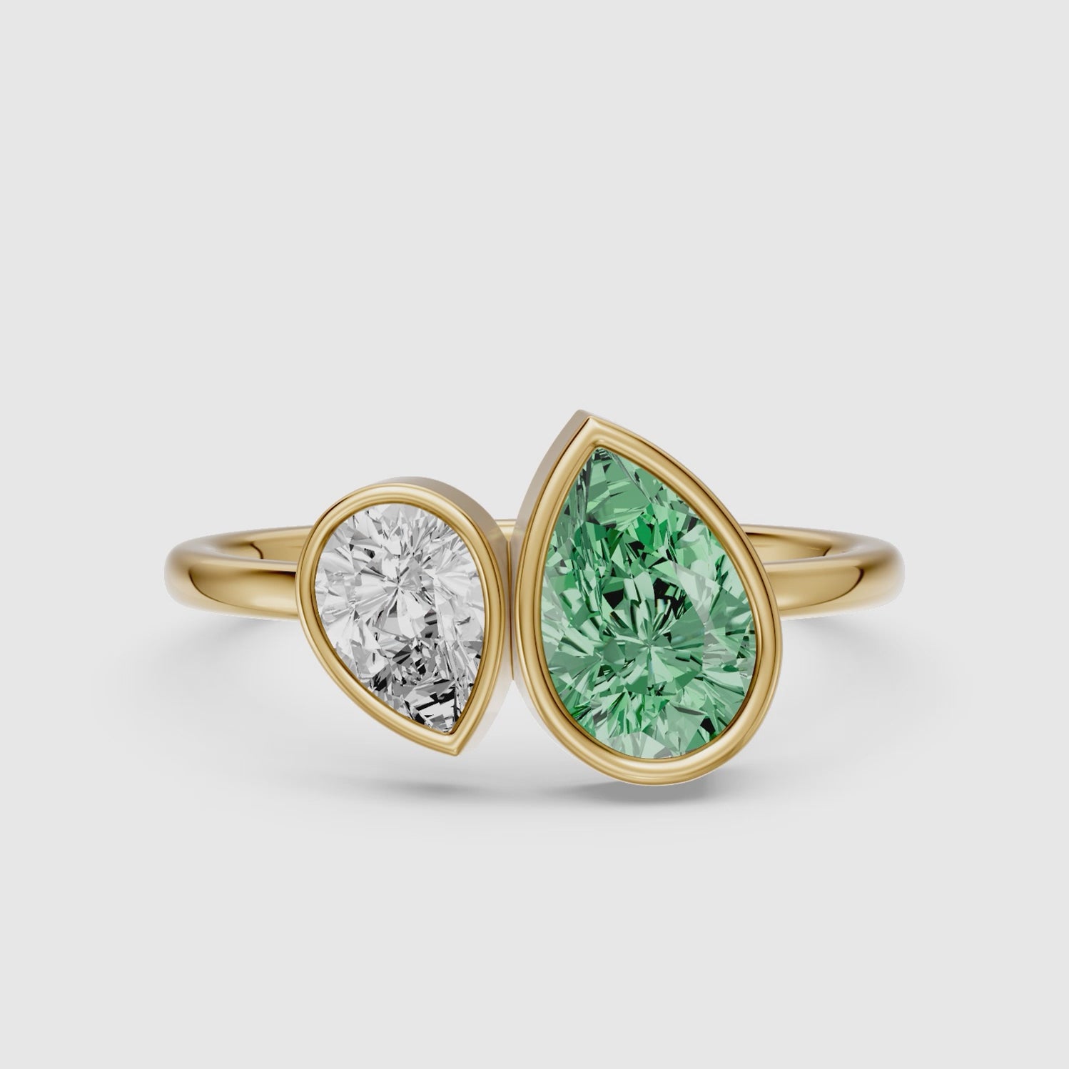 Load video: Oriana Green and White Pear Cut Colored Lab Grown Diamond Toi et Moi Bezel Ring