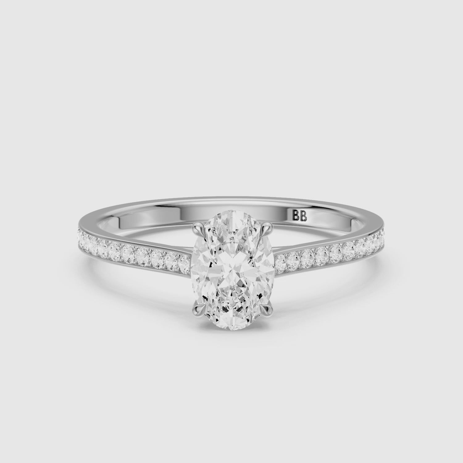 Load video: Ariyah Oval Cut Channel Set Side Stone Moissanite Diamond Ring