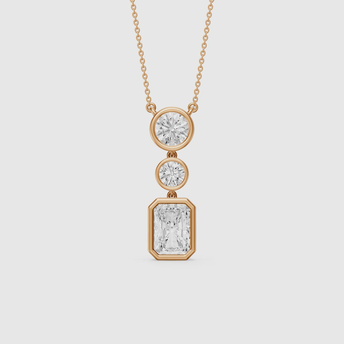 Load video: Laura Radiant Cut and Round Lab Grown Diamond Bezel Drop Pendant