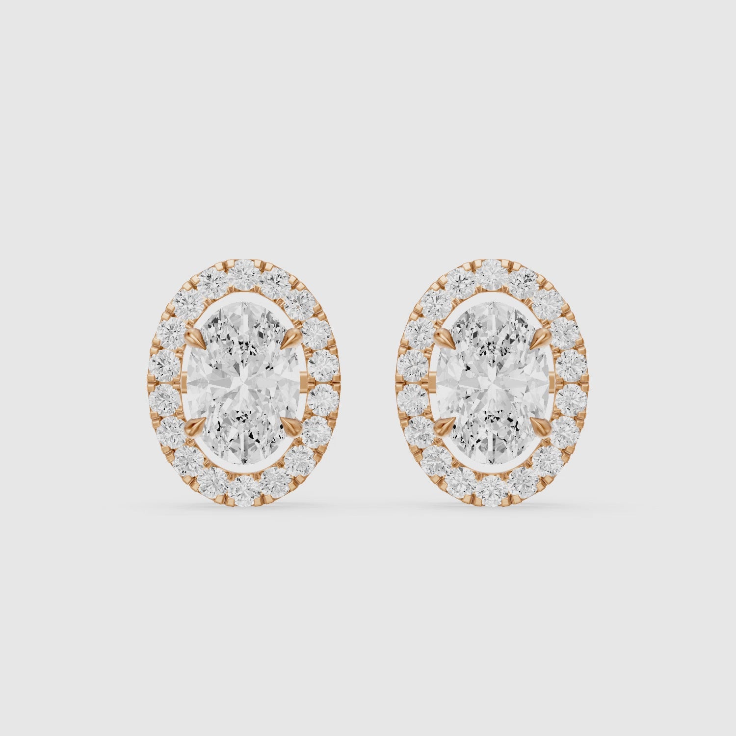 Load video: Vaida Oval Cut Lab Grown Diamond Halo Stud Earrings