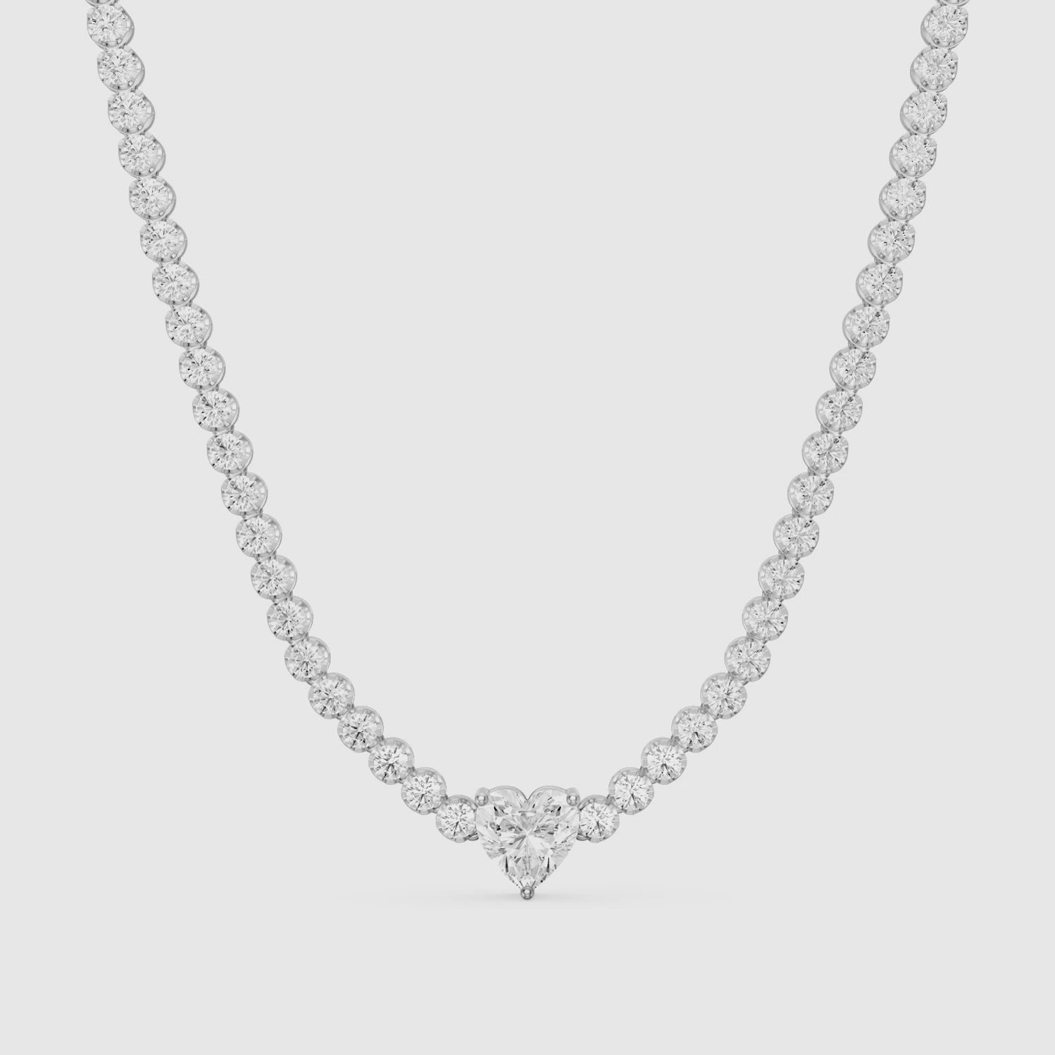 Load video: Mackenzie Round Bezel Lab Grown Diamond Heart Center Necklace