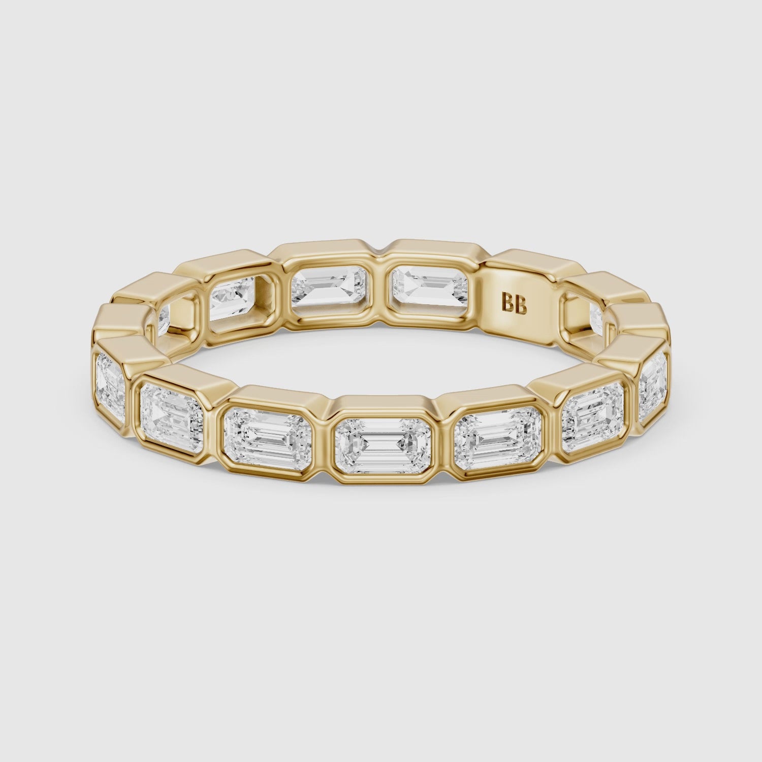 Load video: Billie Emerald Cut Bezel Set Lab Grown Diamond Eternity Wedding Band