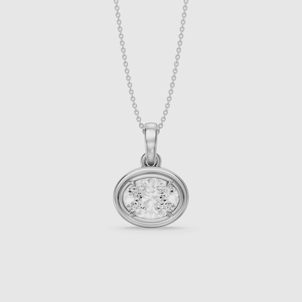 Load video: Londyn Oval Cut Lab Grown Diamond Bezel with Prong Pendant