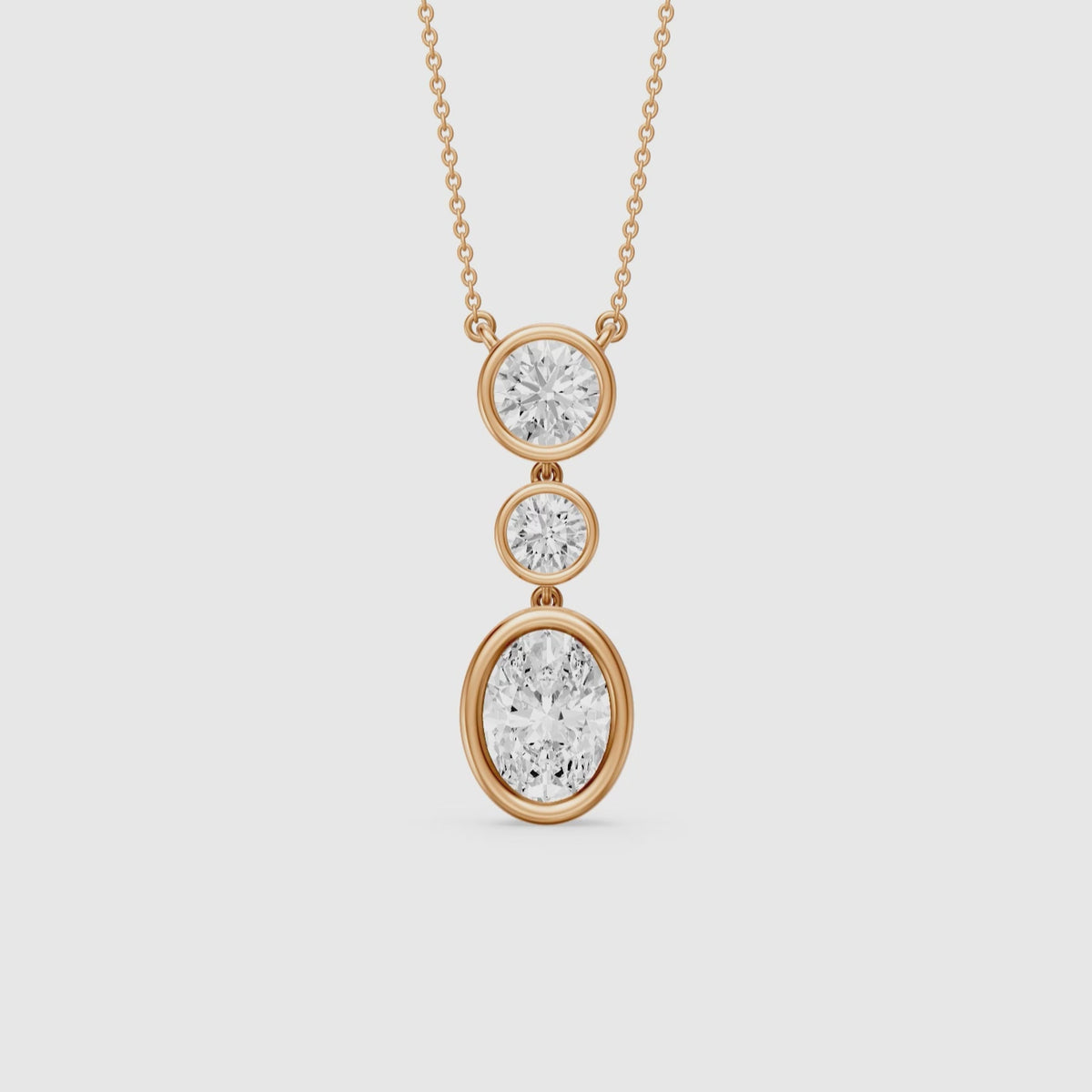 Load video: Malani Oval Cut and Round Cut Bezel Lab Grown Diamond Drop Pendant