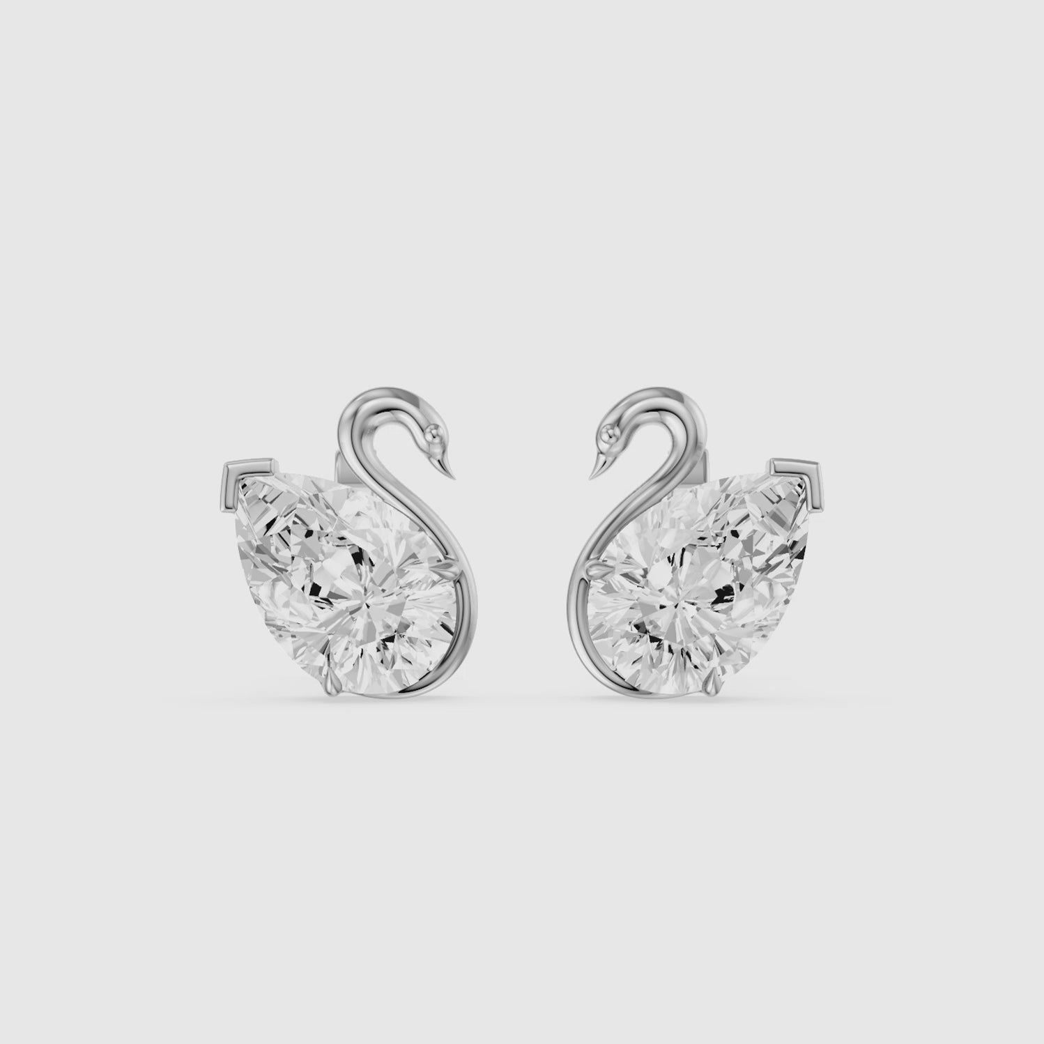 Load video: Solene Pear Cut Lab Grown Diamond Swan Stud Earrings