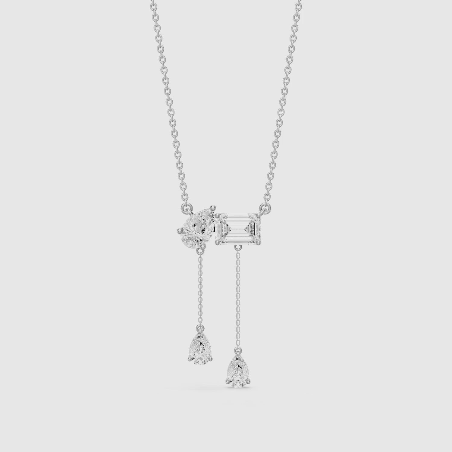 Load video: Flora Pear and Emerald Cut Lab Grown Diamond Tassel Necklace
