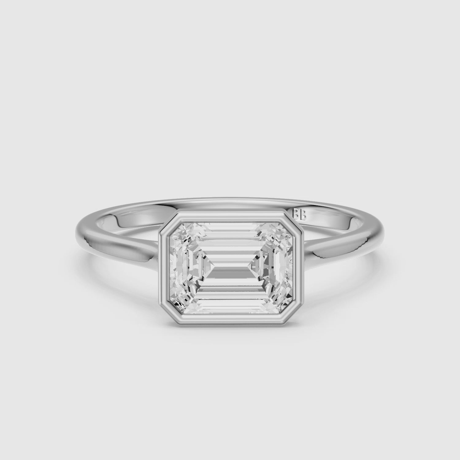 Load video: Abigail Emerald Cut East West Bezel Set Solitaire Moissanite Diamond Ring