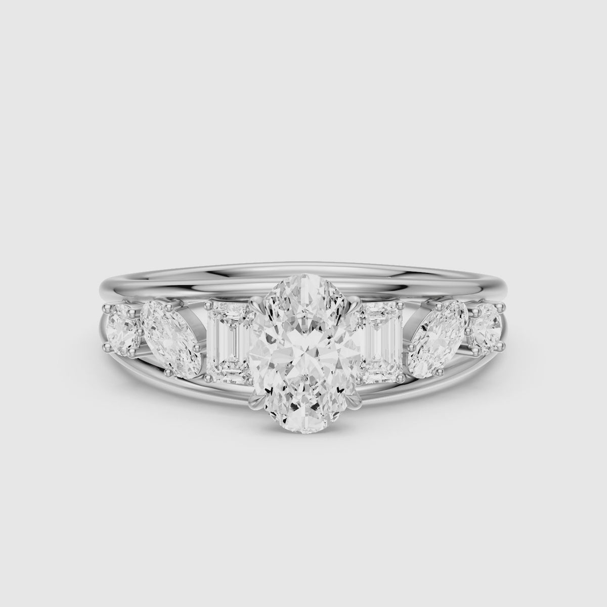 Load video: Neve Oval Moissanite Diamond Ring with Round, Oval &amp; Emerald Cut Side Diamonds