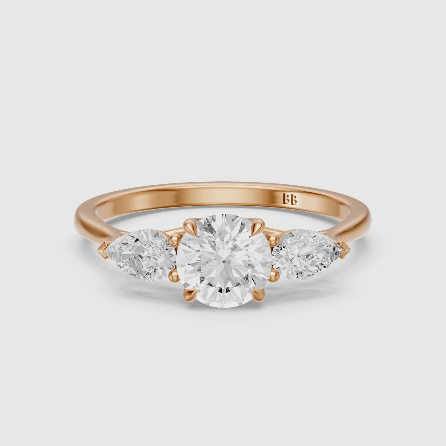 Load video: Emmill Three Stone Round Cut Lab Grown Diamond Ring WIth Pear Side Stone