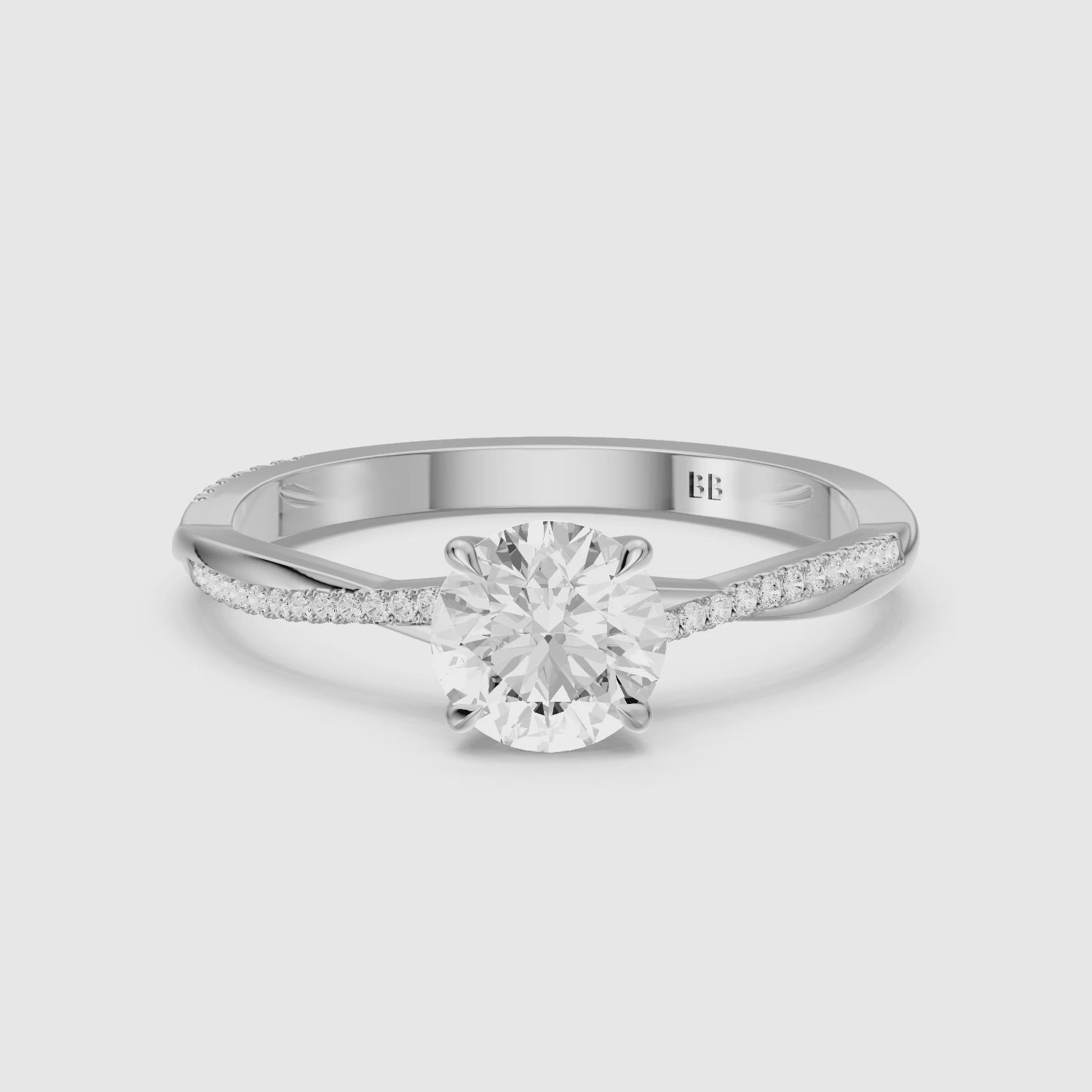 Load video: Carrie Round Cut Twisted Pave Side Stone Moissanite Diamond Ring