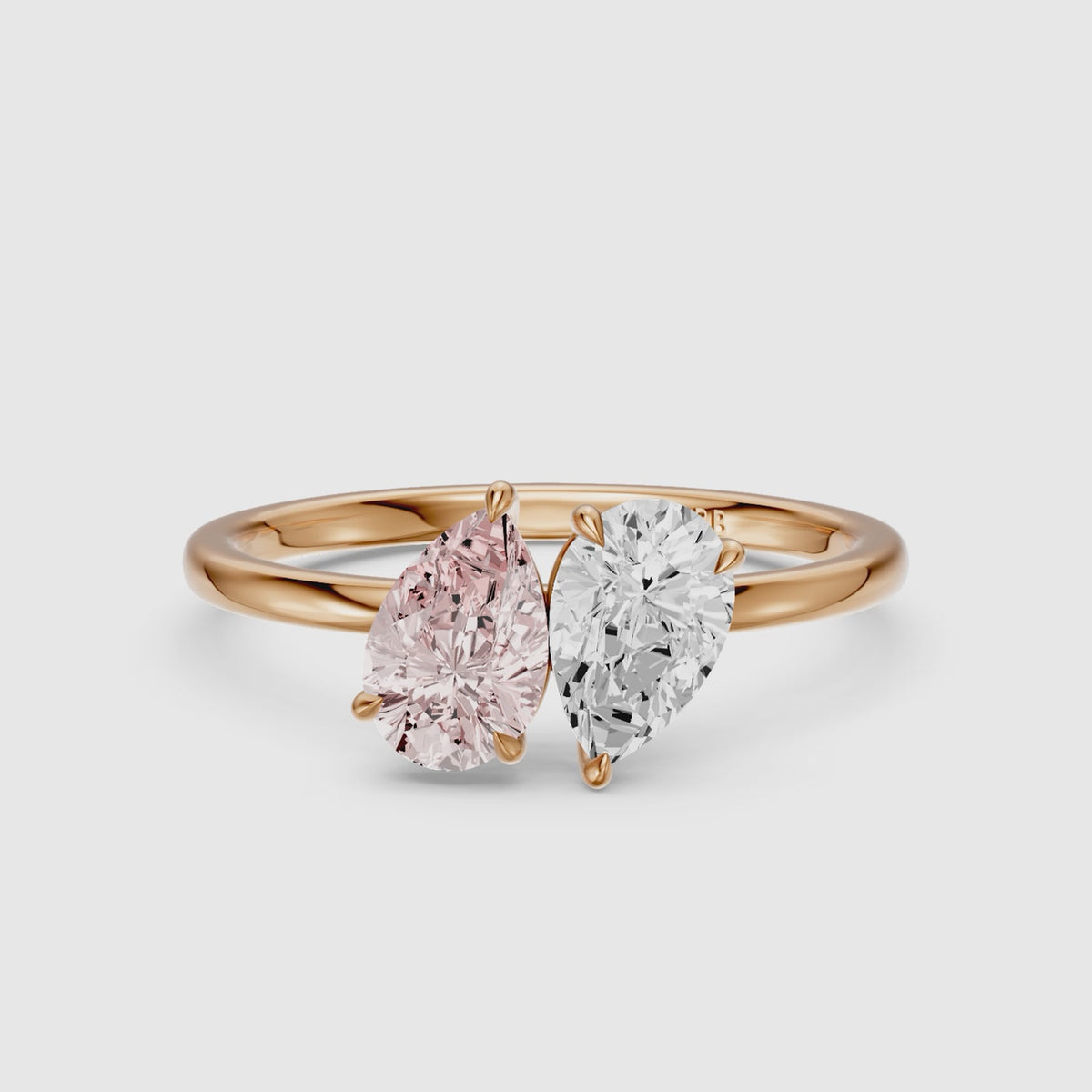 Load video: Audra Pink and White Both Pear Cut Color Lab Grown Diamond Toi et Moi Ring