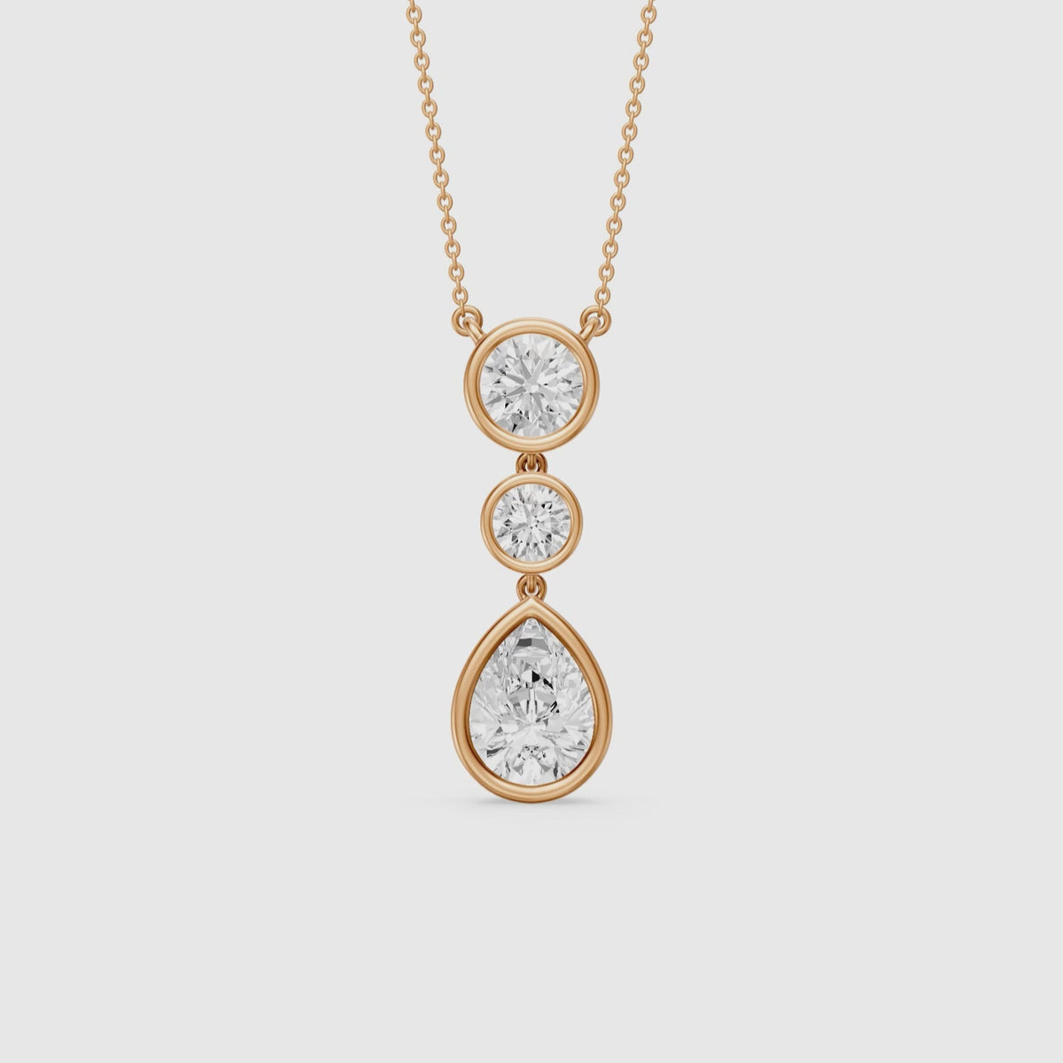 Load video: Anya Pear Shape and Round Bezel Drop Lab Grown Diamond Pendant