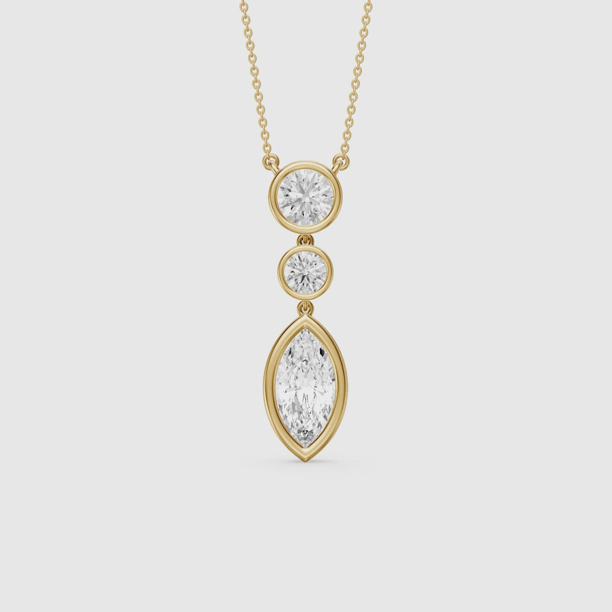 Load video: Astrid Marquise and Round Lab Grown Diamond Bezel Drop Pendant