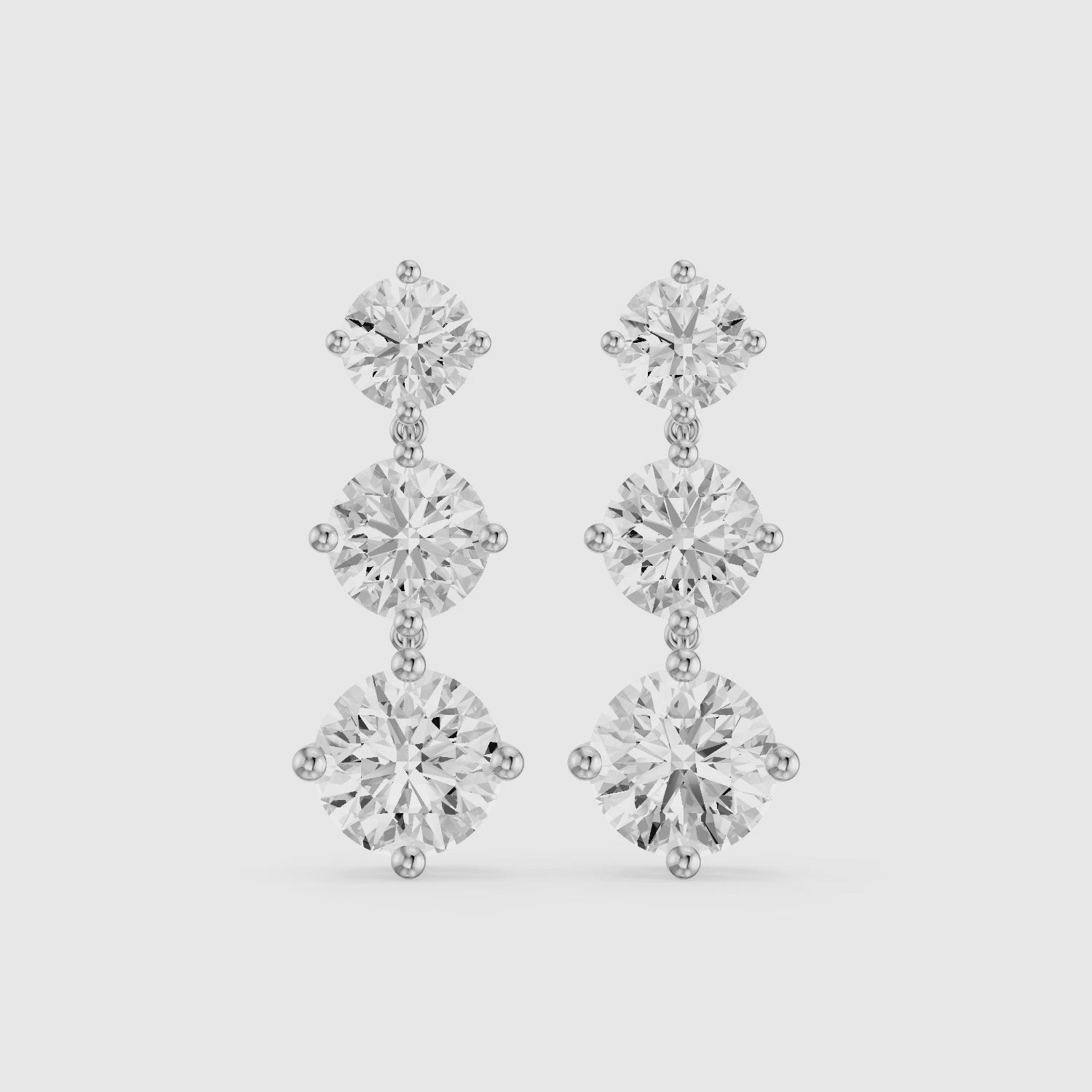 Load video: Danica Round Lab Grown Diamond Three Stone Graduated Drop Earrings