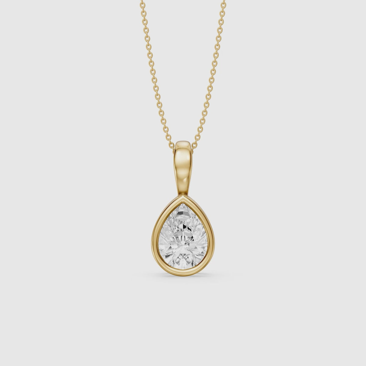 Load video: Mary Pear Shape Bezel Set Lab Grown Diamond Solitaire Pendant