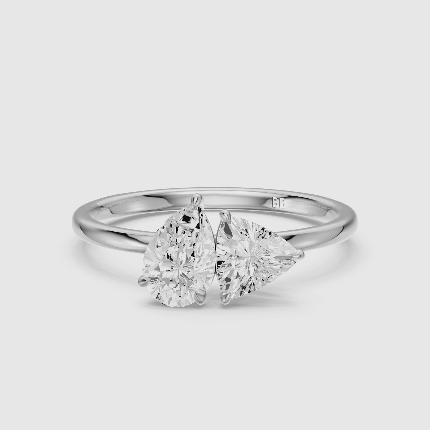 Load video: Roselyn Toi Et Moi Engagement Ring With Pear and Trillion Cut Lab Grown Diamond