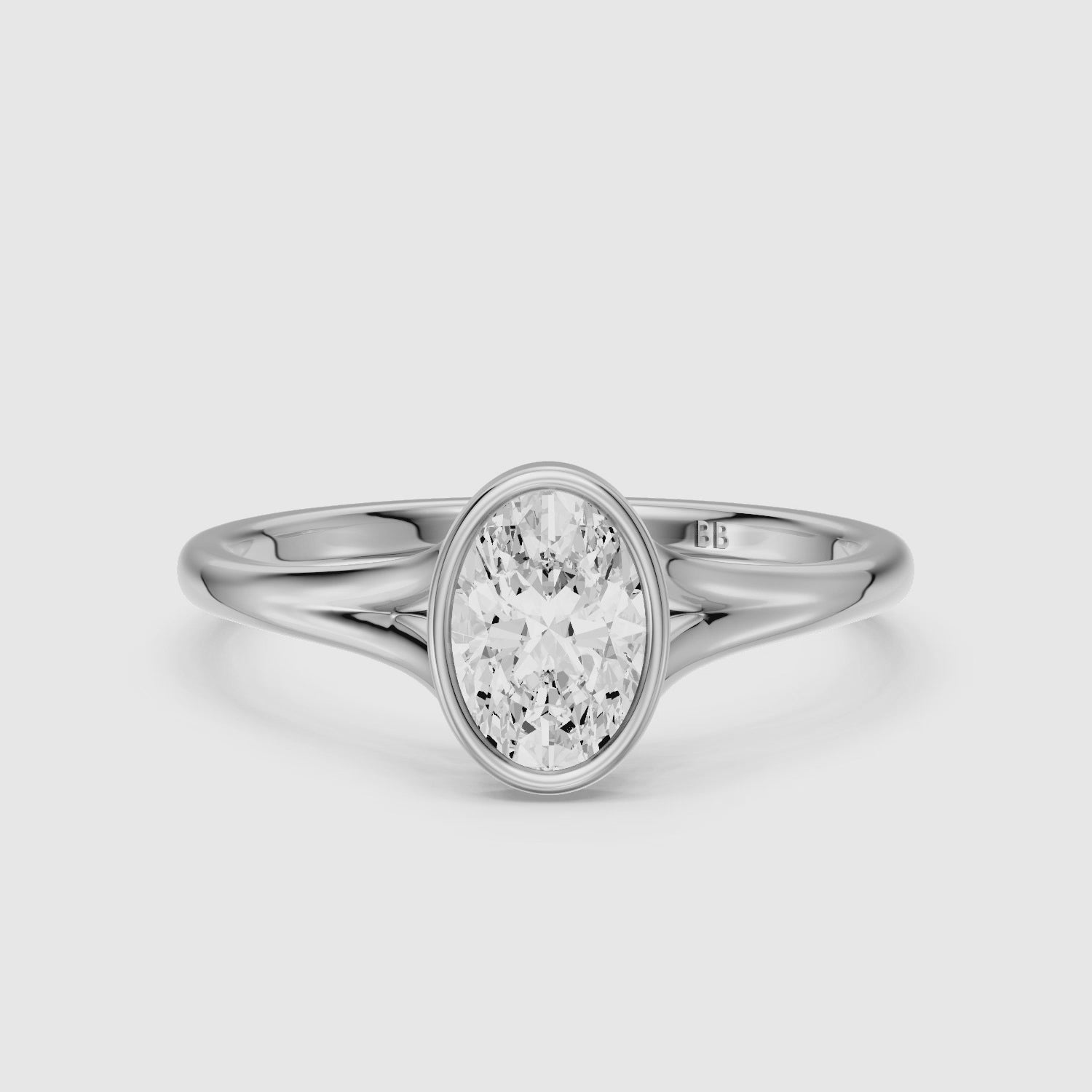 Load video: Ember Oval Cut Lab Grown Diamond Ring in Bezel Set Split Shank Style
