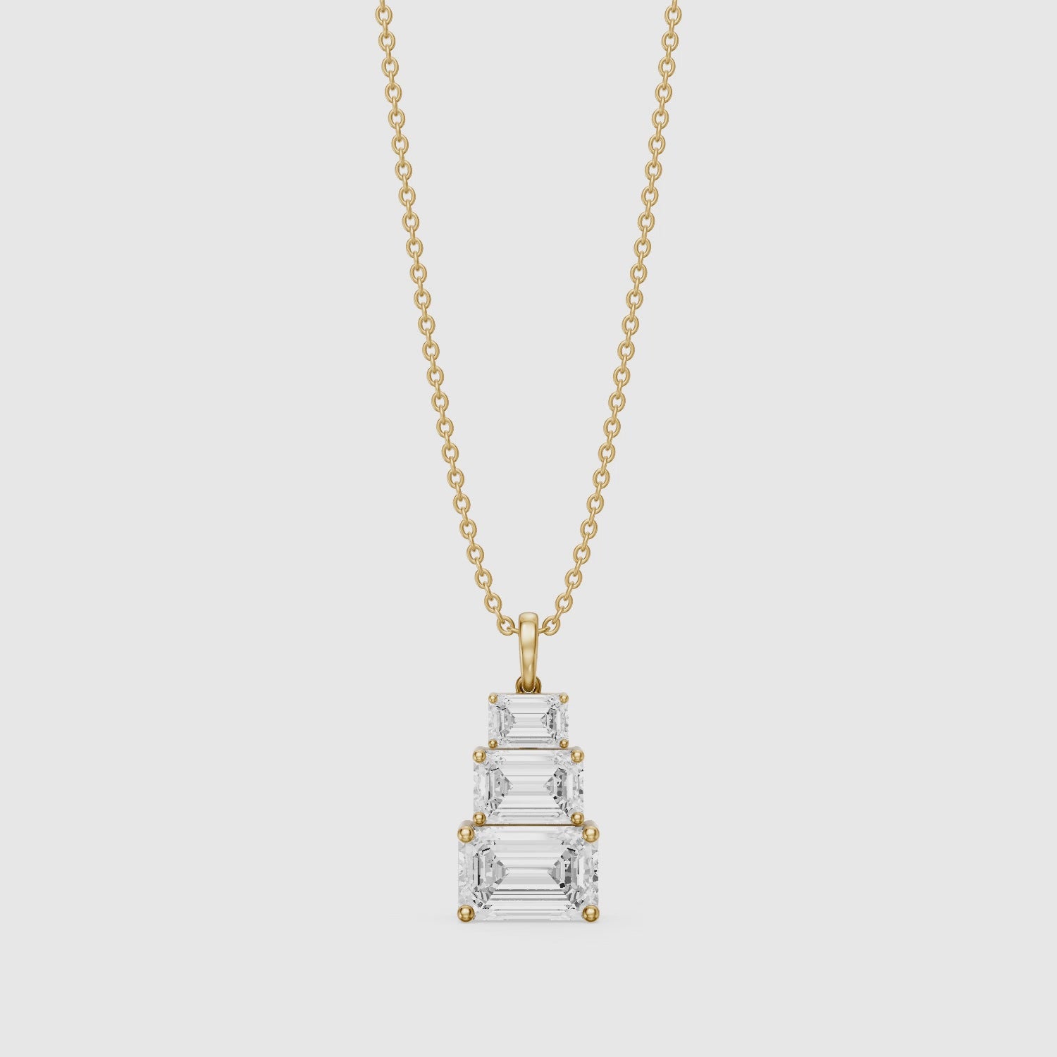Load video: Carla Emerald Cut Lab Grown Diamond Graduated Pendant