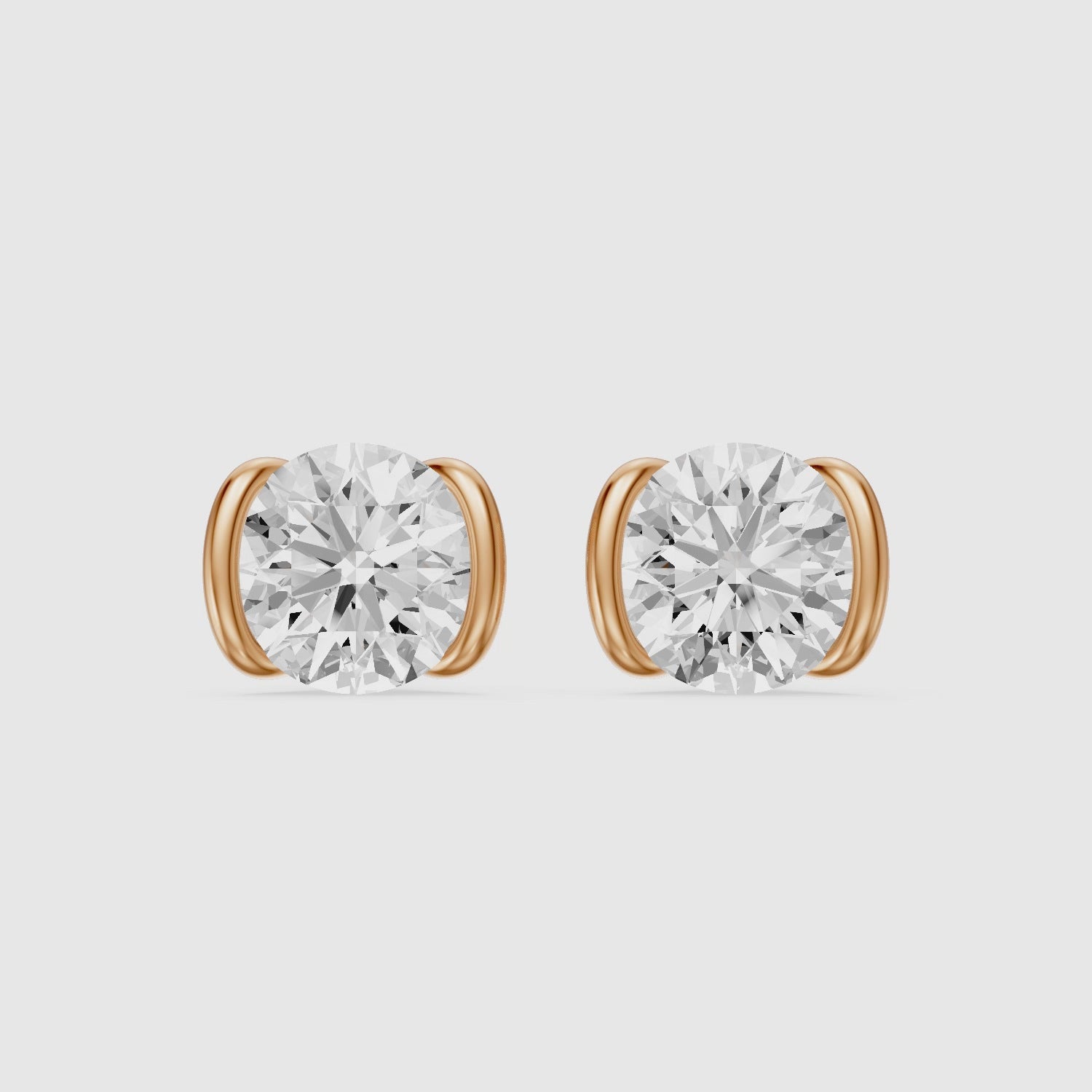 Load video: Aina Round Cut Lab Grown Diamond half Bezel Stud Earrings
