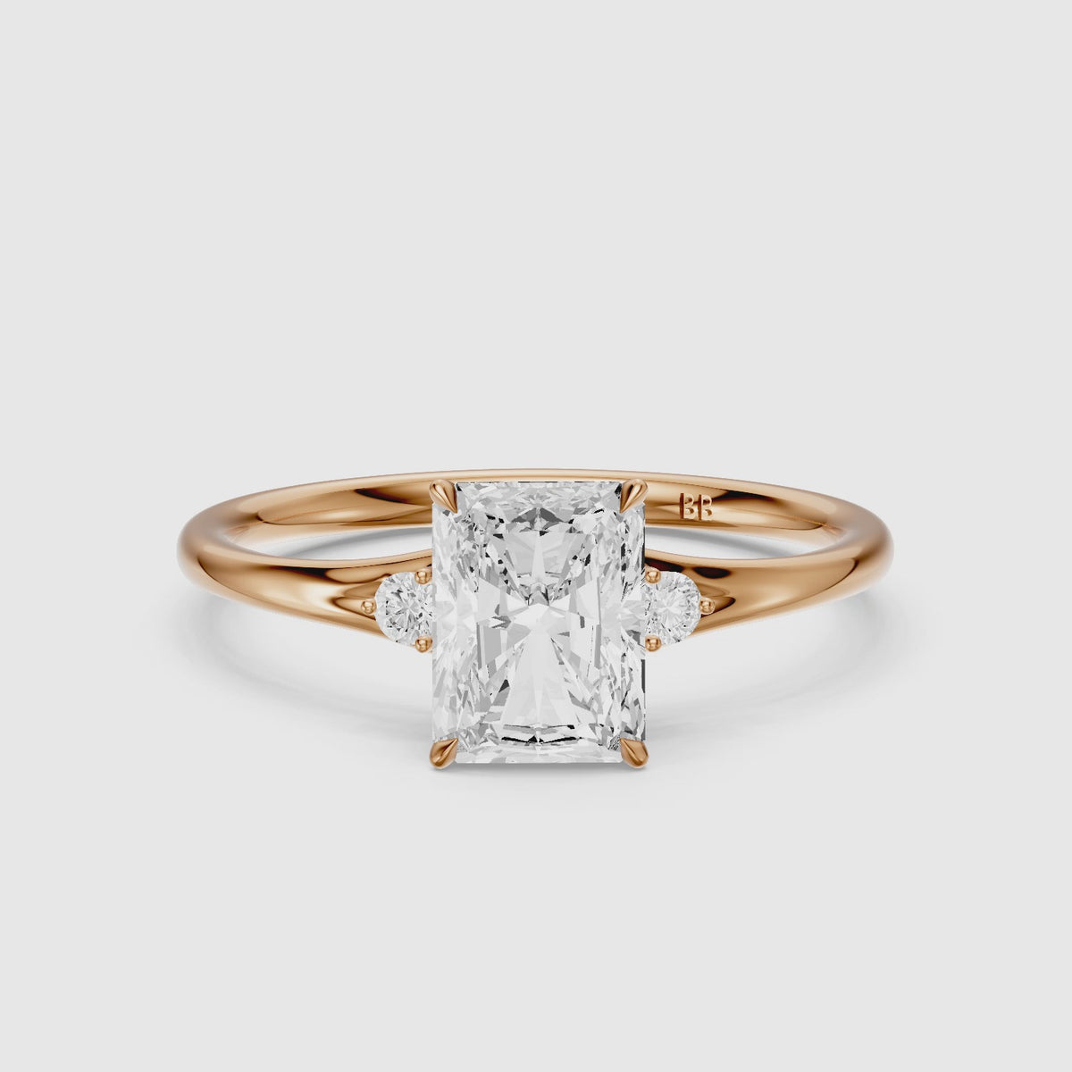Load video: Lumi Radiant Cut Side Stone Sculptural Moissanite Diamond Ring