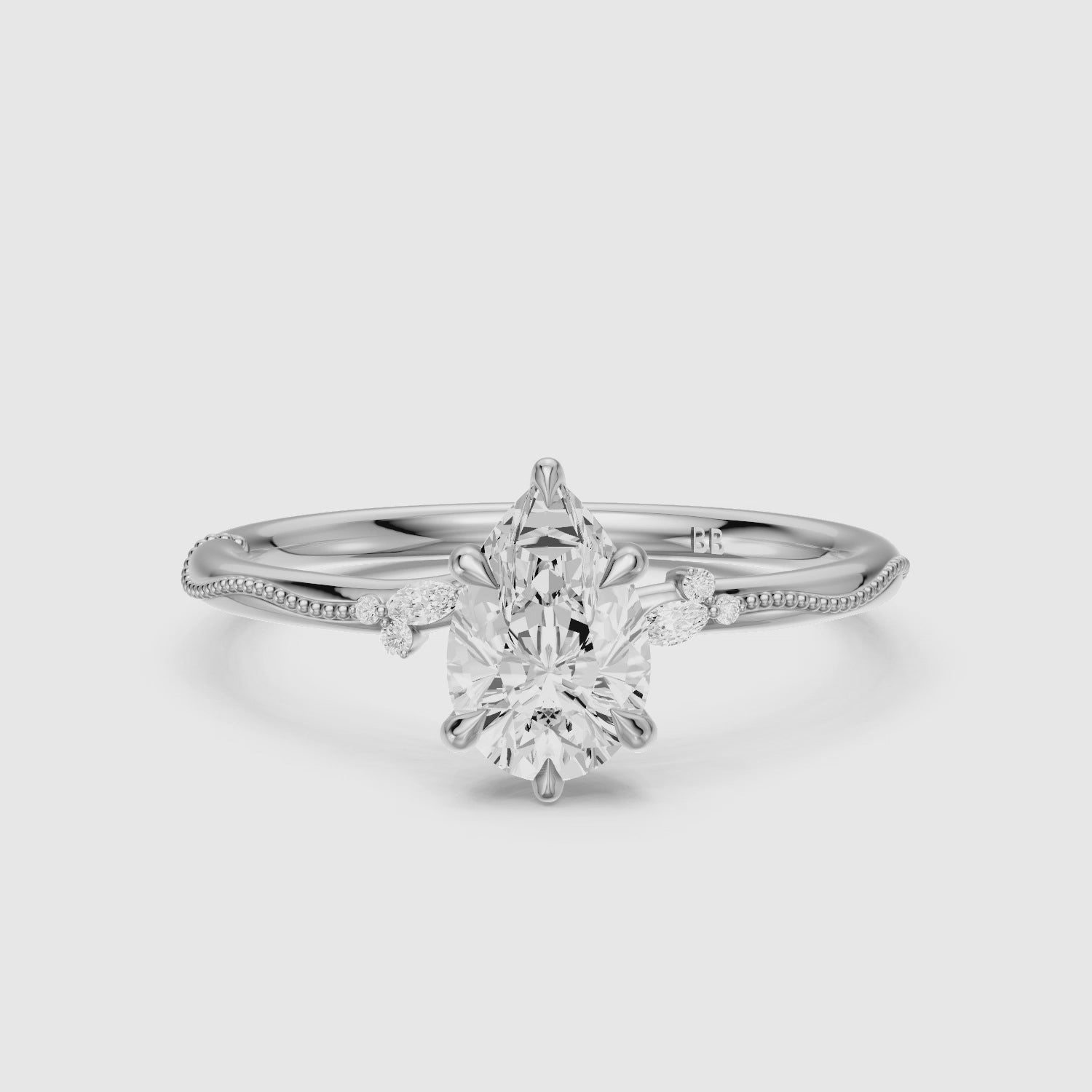Load video: Cecilia Pear Cut Side Stone Lab Grown Diamond Ring with Milgrain Band
