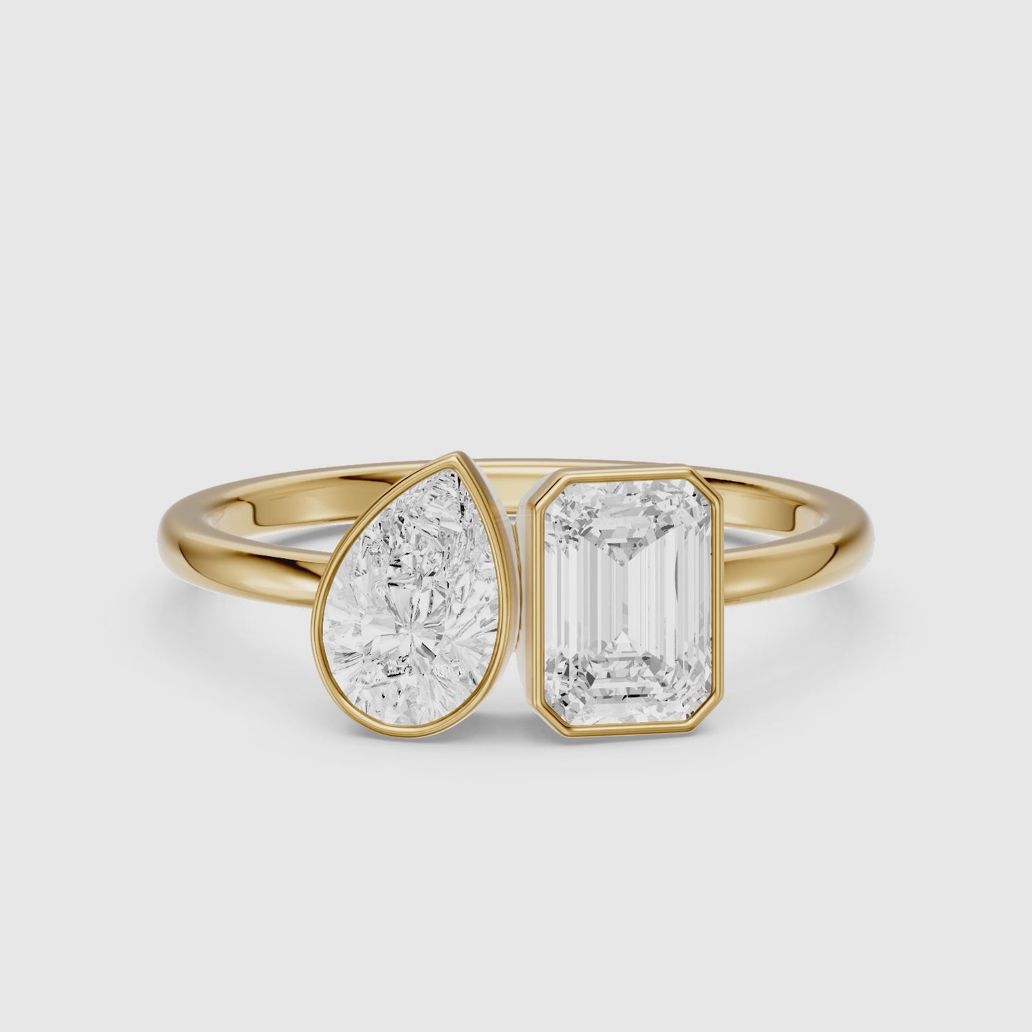 Load video: Cierra Toi Et Moi Bezel Diamond Ring With Pear and Emerald Two Stone Lab Grown Diamond