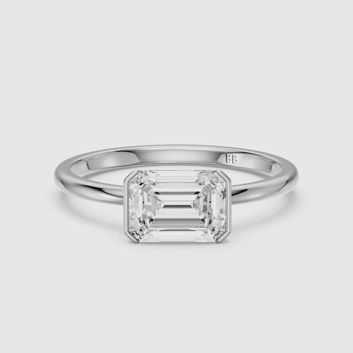 Load video: Kennedy Emerald Cut East West Half Bezel Lab Grown Diamond Ring