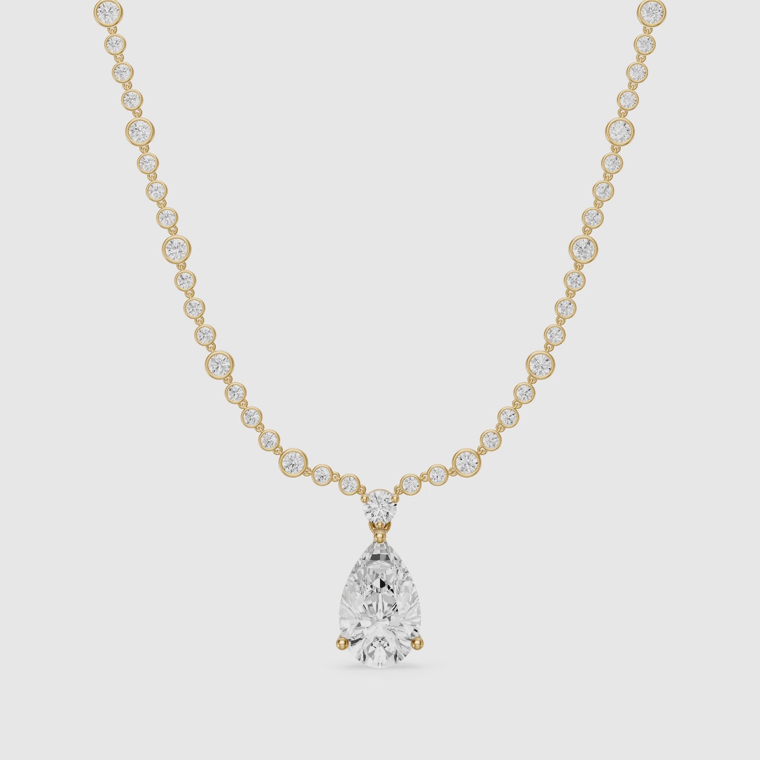 Load video: Estella Graduated Round Bezel Lab Grown Diamond Pear Drop Necklace