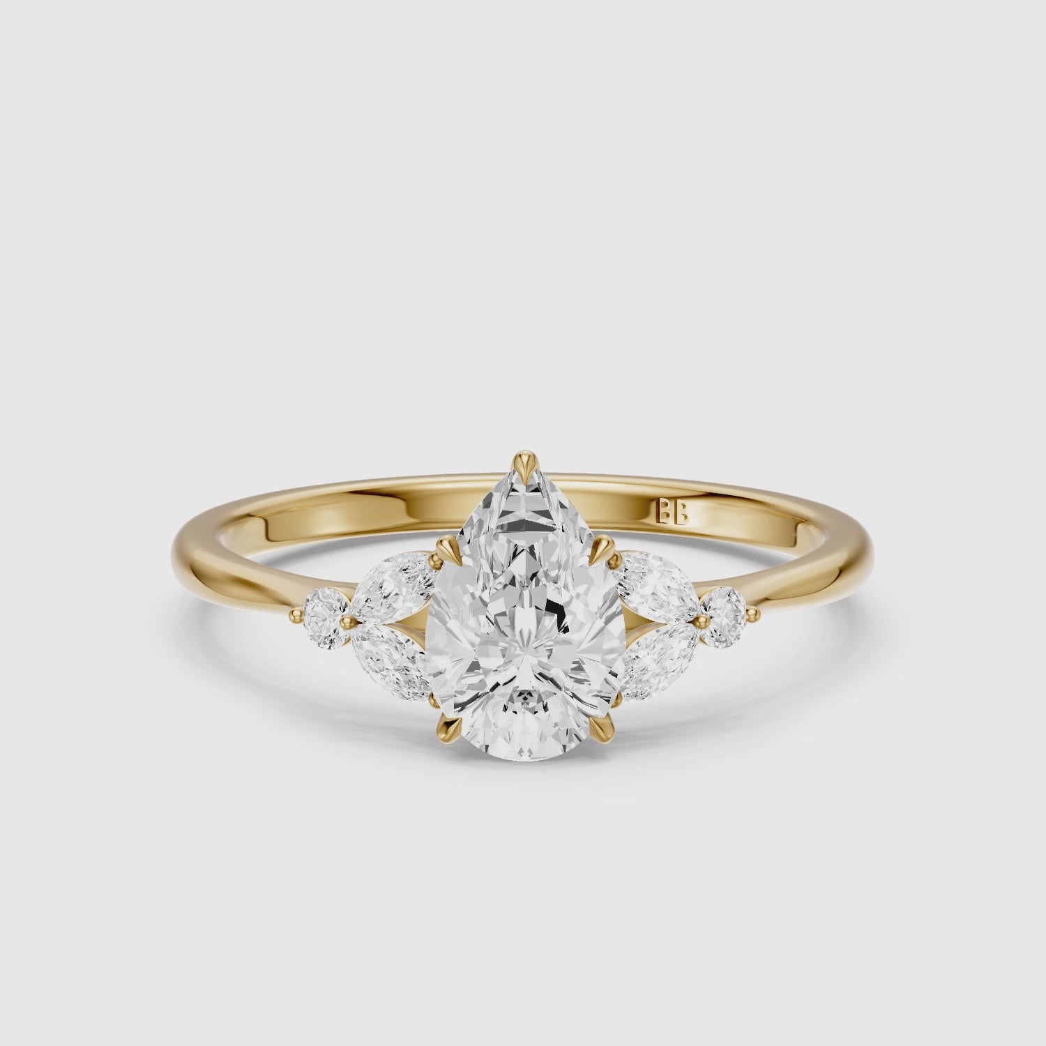 Load video: Liora Pear Cut Moissanite Diamond Ring with Marquise Side Stone Cluster