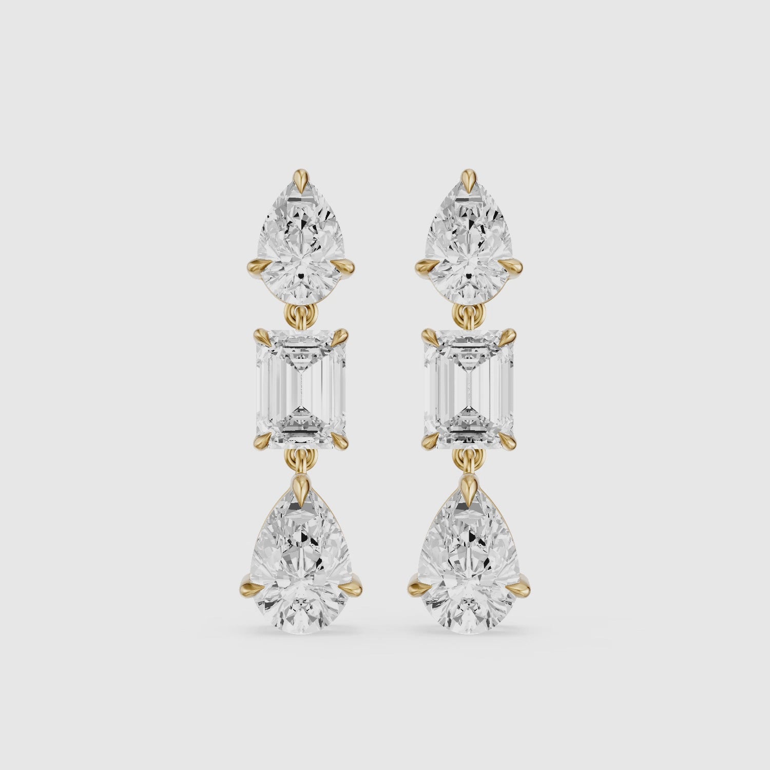 Load video: Acacia Emerald Cut and Pear Lab Grown Diamond Three Stone Drop Earrings