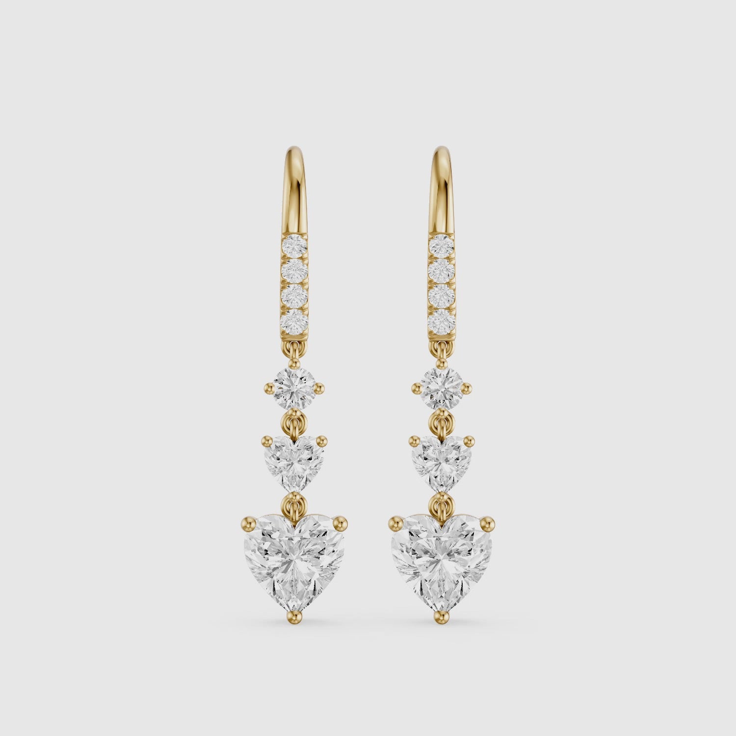 Load video: Yasmin Graduated Heart and Round Lab Grown Diamond Dangle Earrings