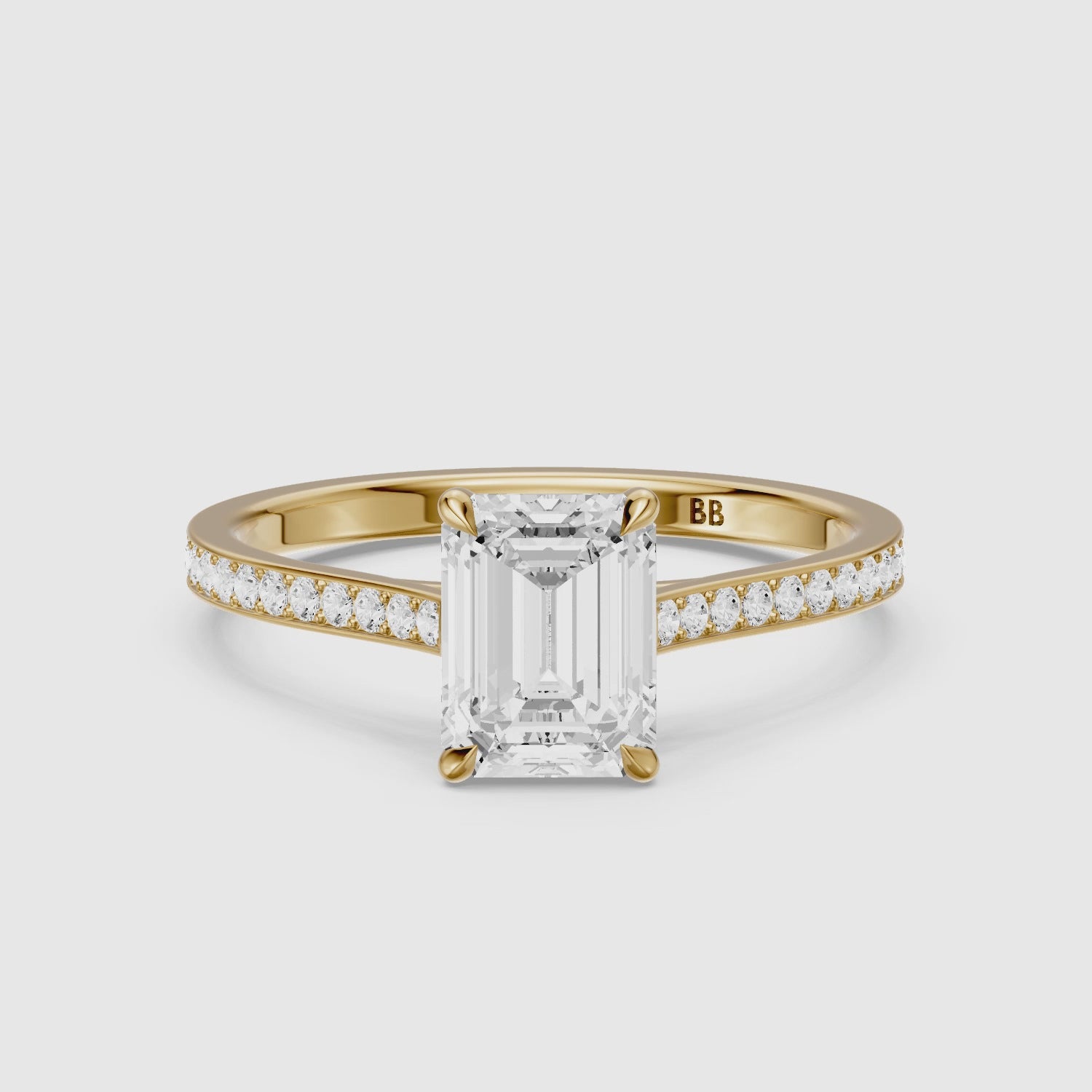 Load video: Raegan Emerald Cut Side Stone Channel Set Moissanite Diamond Ring