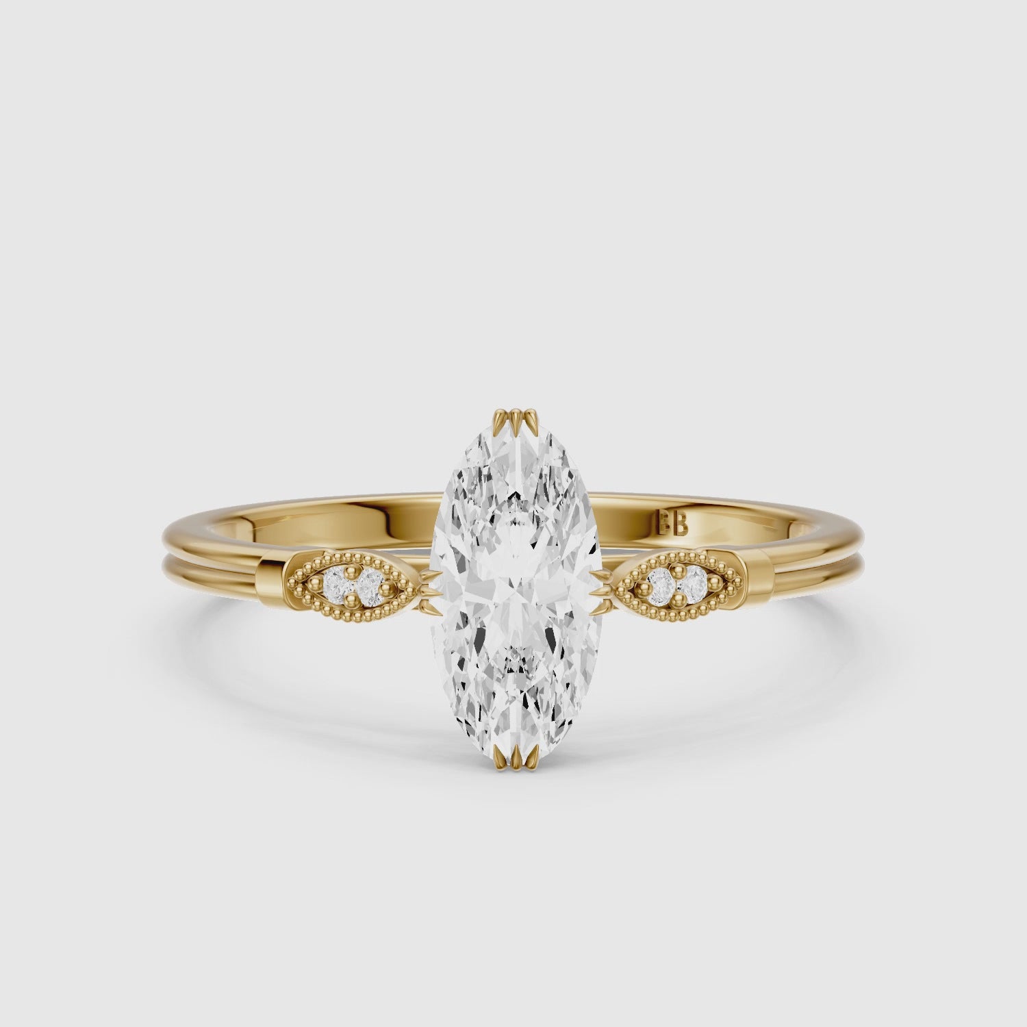 Load video: Serena Moval Cut Side Stone Moissanite Diamond Ring with Triple Claw Prongs